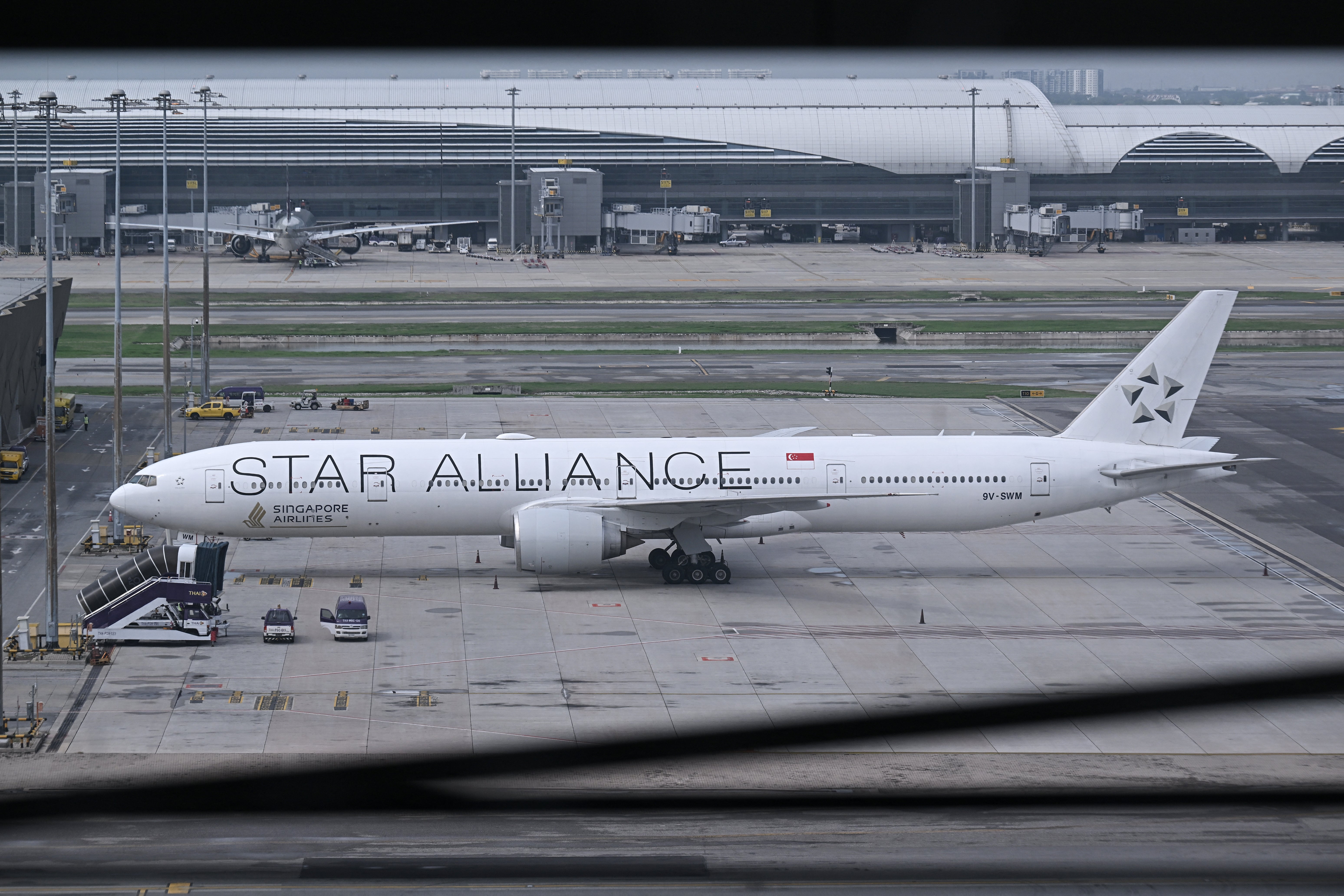 Singapore Airlines flight SQ321, which was headed to Singapore from London before making an emergency landing in Bangkok due to severe turbulence, is seen on the tarmac at the Suvarnabhumi International Airport in Bangkok on 22 May 2024