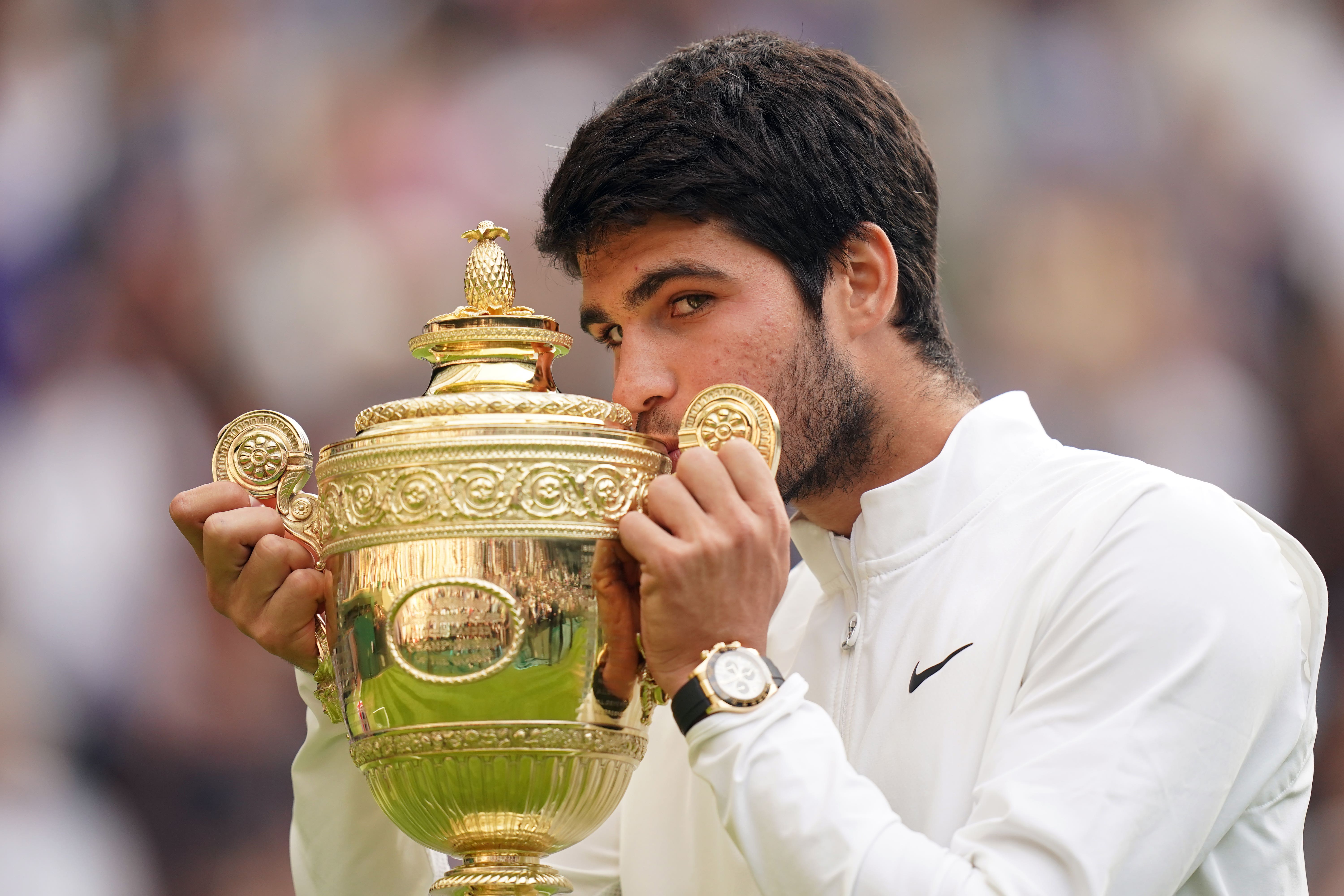 Carlos Alcaraz with the Wimbledon trophy (Adam Davy/PA)