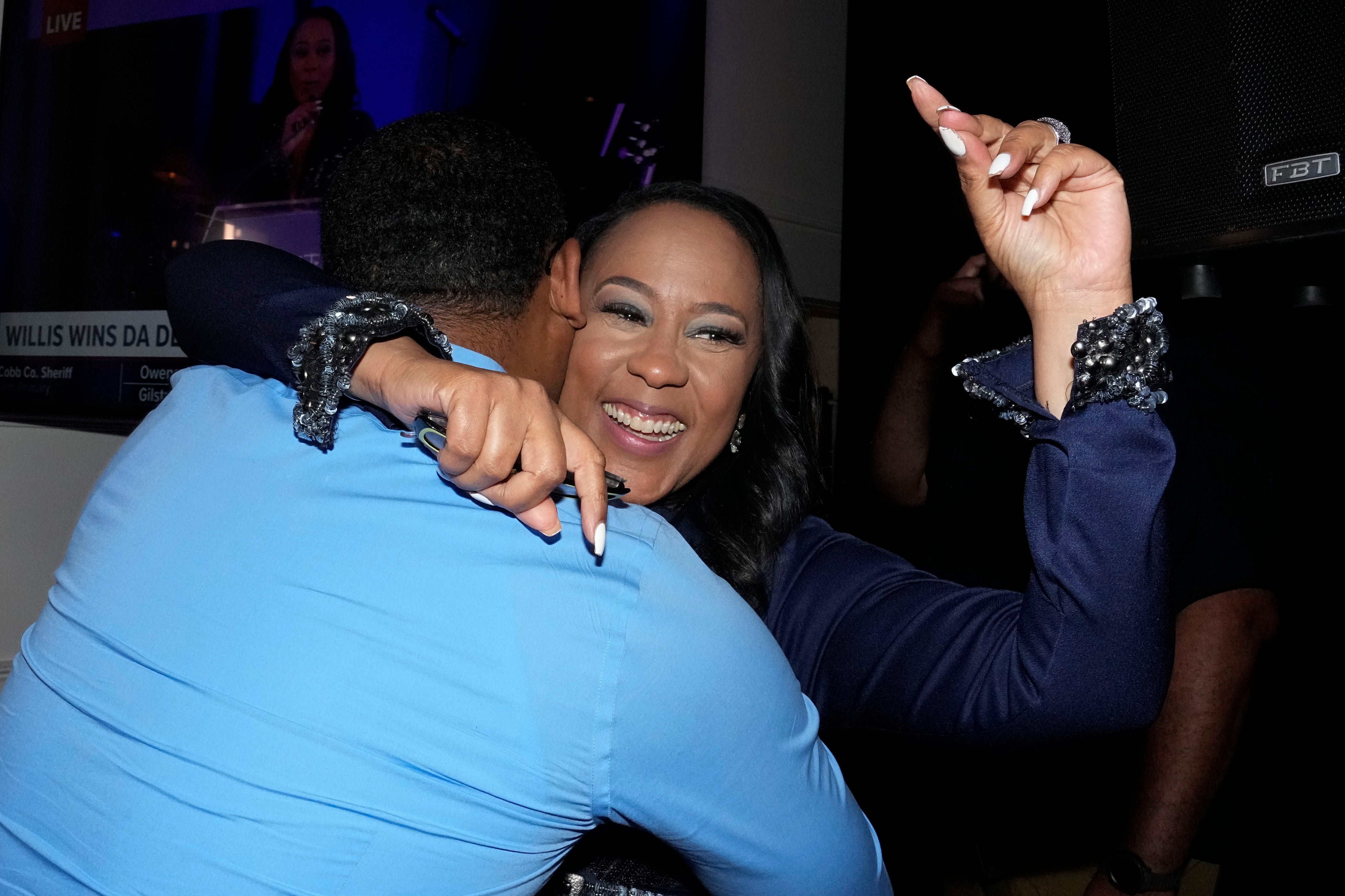 Fulton County District Attorney Fani Willis celebrates winning re-election in the primary on Tuesday May 21