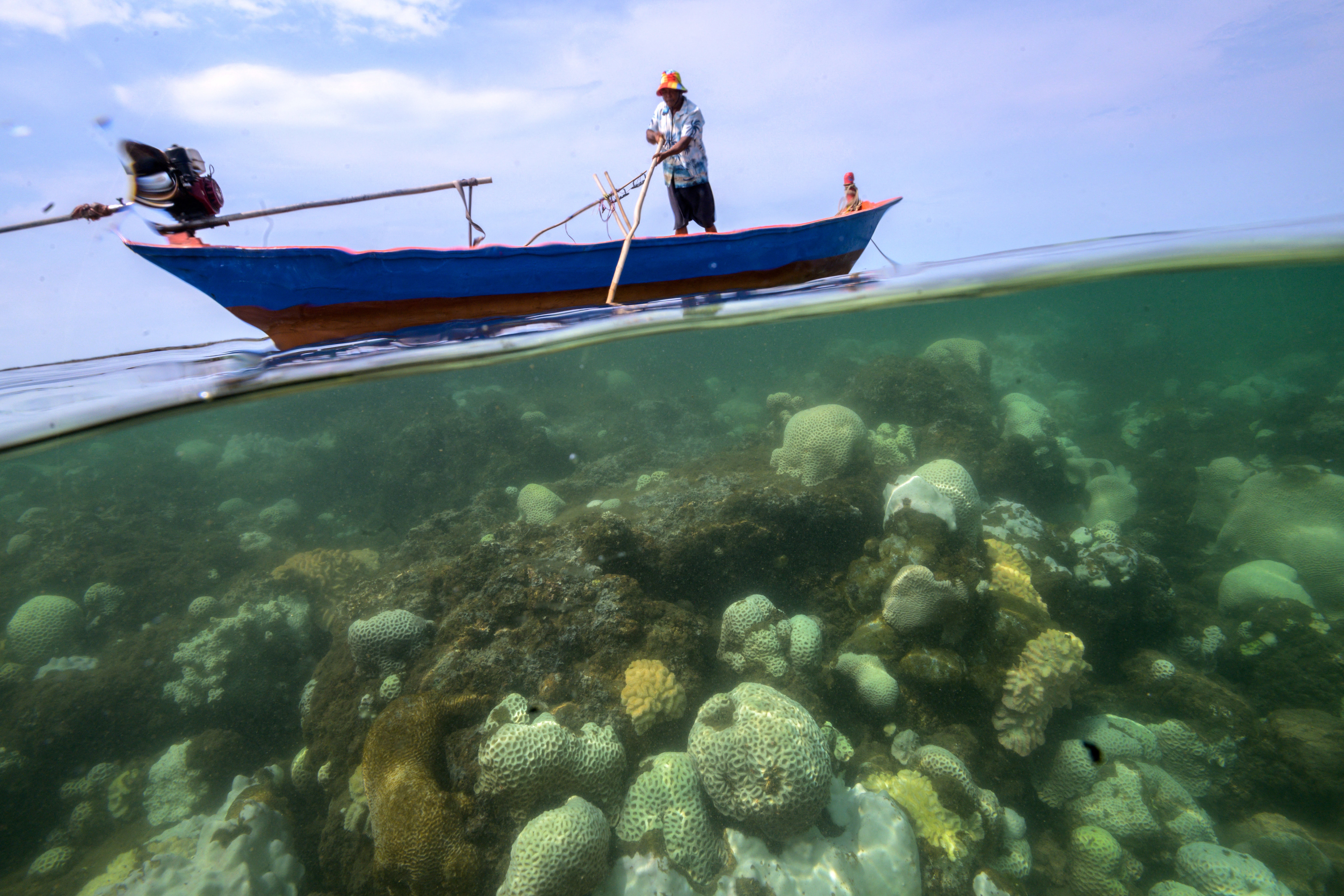 Sommay Singsura, a fisherman, is seen close to bleached corals near Chao Lao Beach, Chantaburi province, Thailand, May 10, 2024