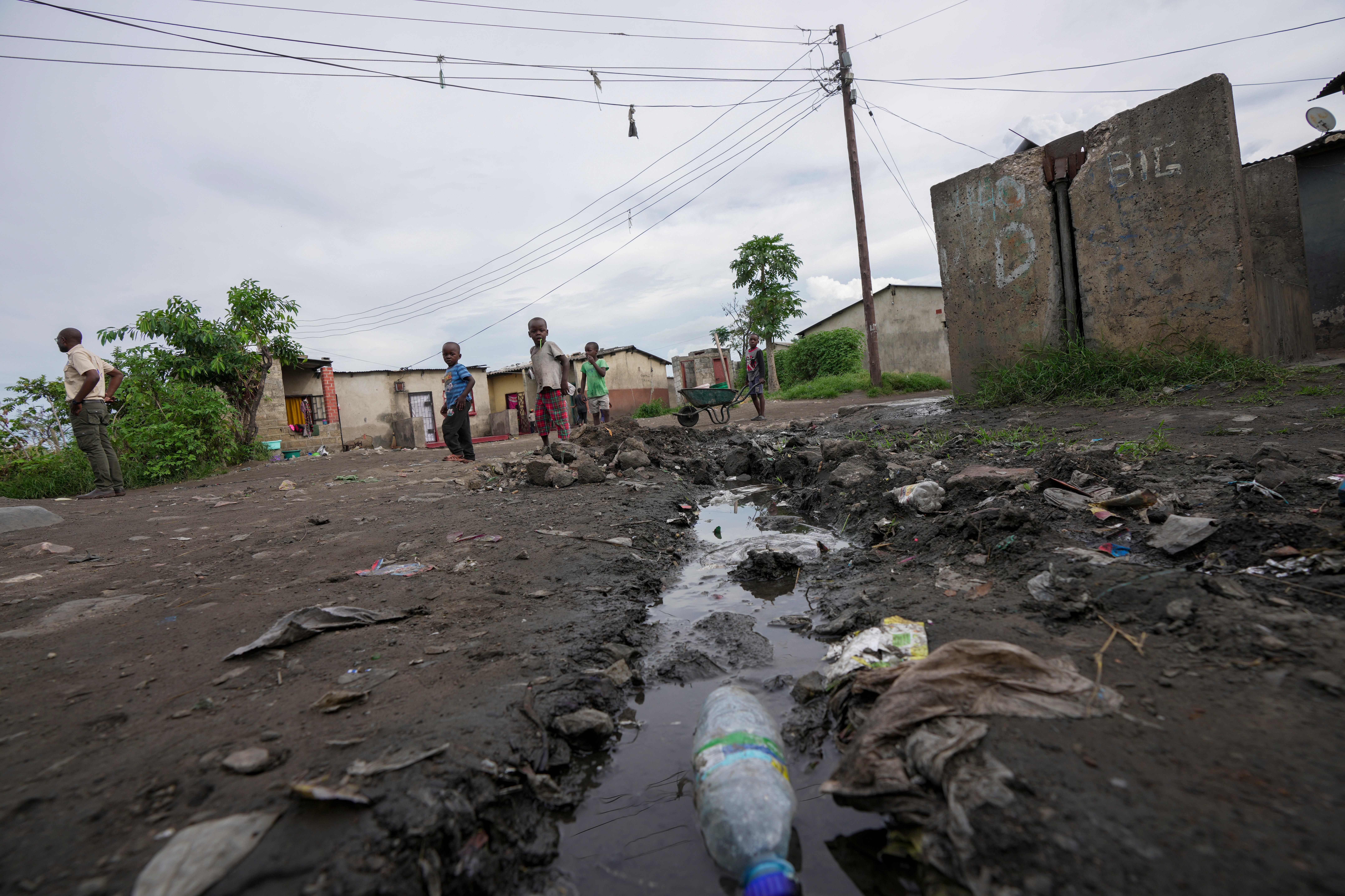 Children play near stagnant pools of water near Lilanda, Zambia