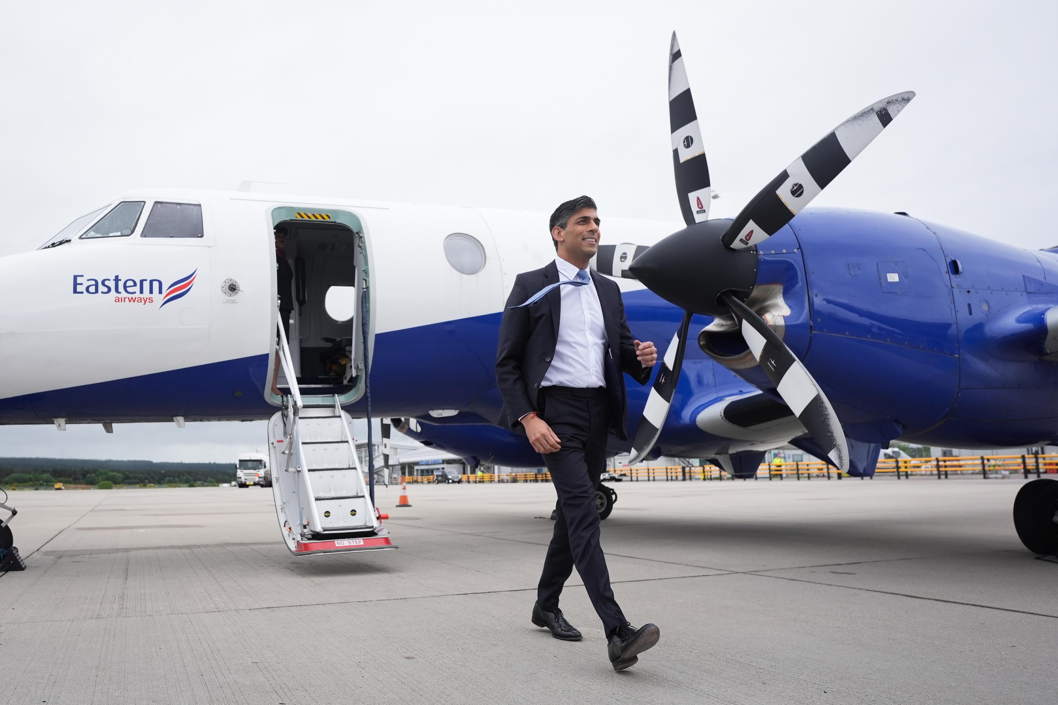 Prime Minister Rishi Sunak arrives at Inverness Airport (PA)