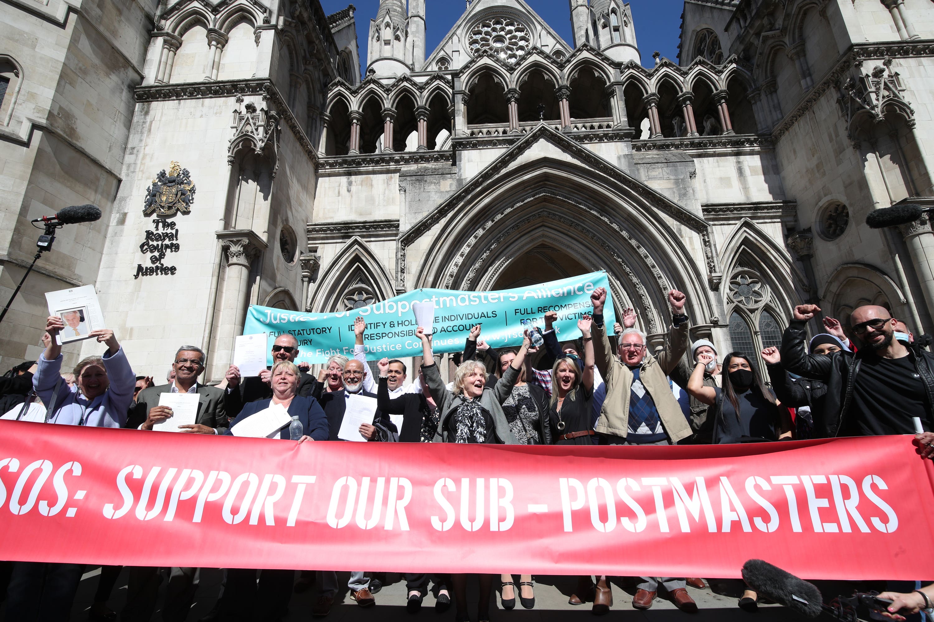 Former post office workers outside the Royal Courts of Justice in 2021 (PA)