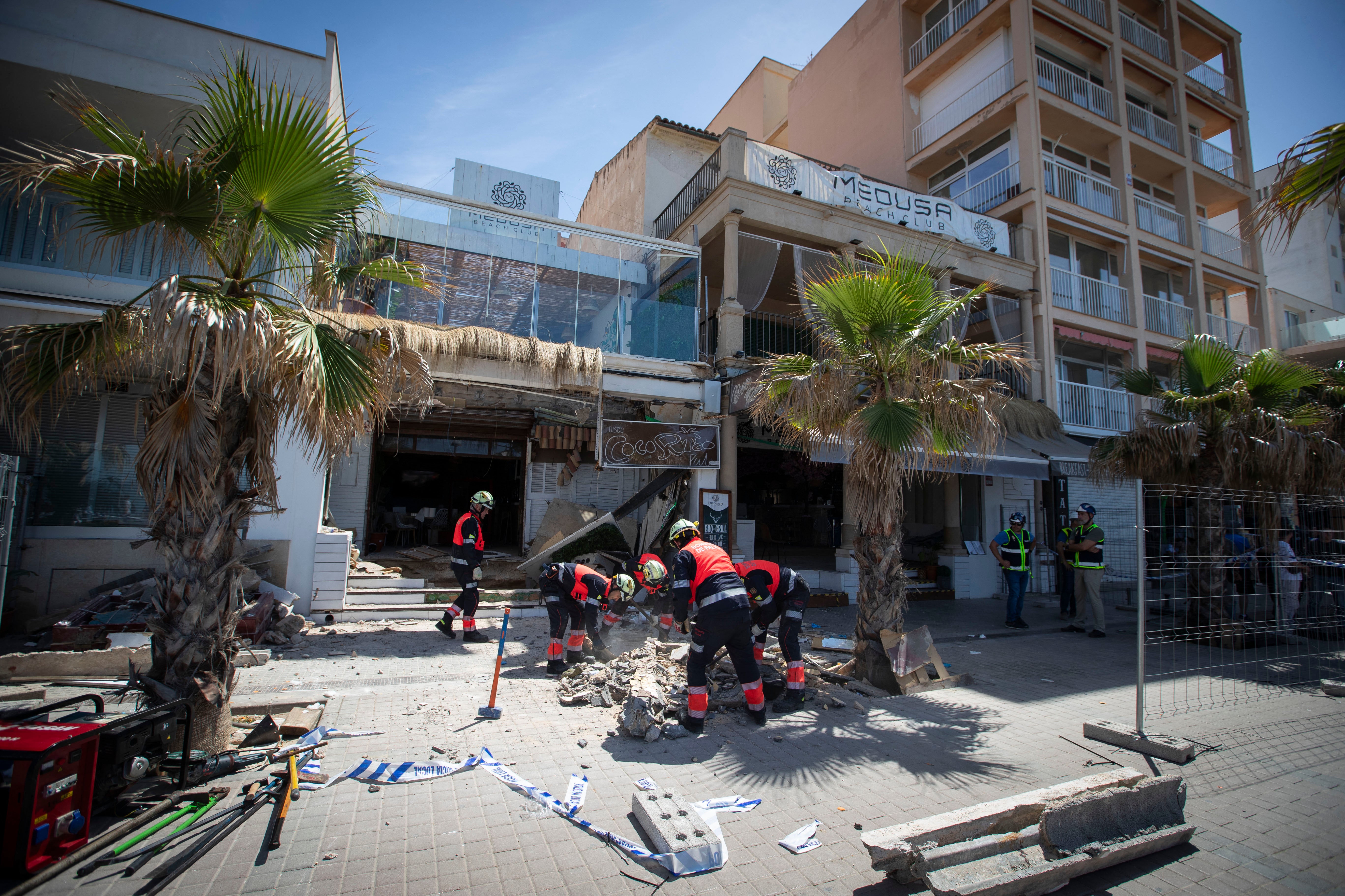 Firefighters work one day after the two-storey restaurant collapsed