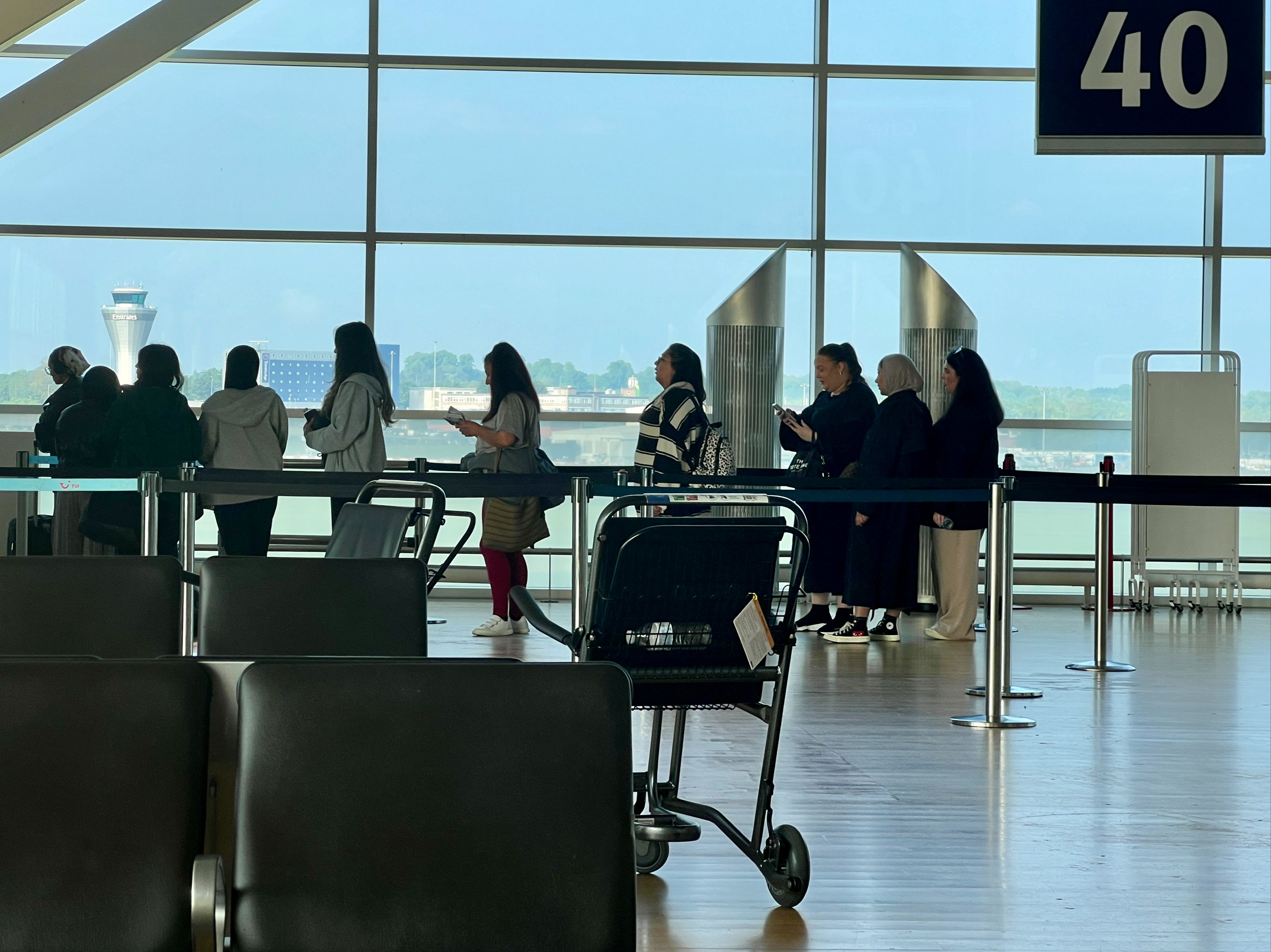 Going places: Passengers at Birmingham airport, where 15 per cent more people are expected than over the same spell in 2023