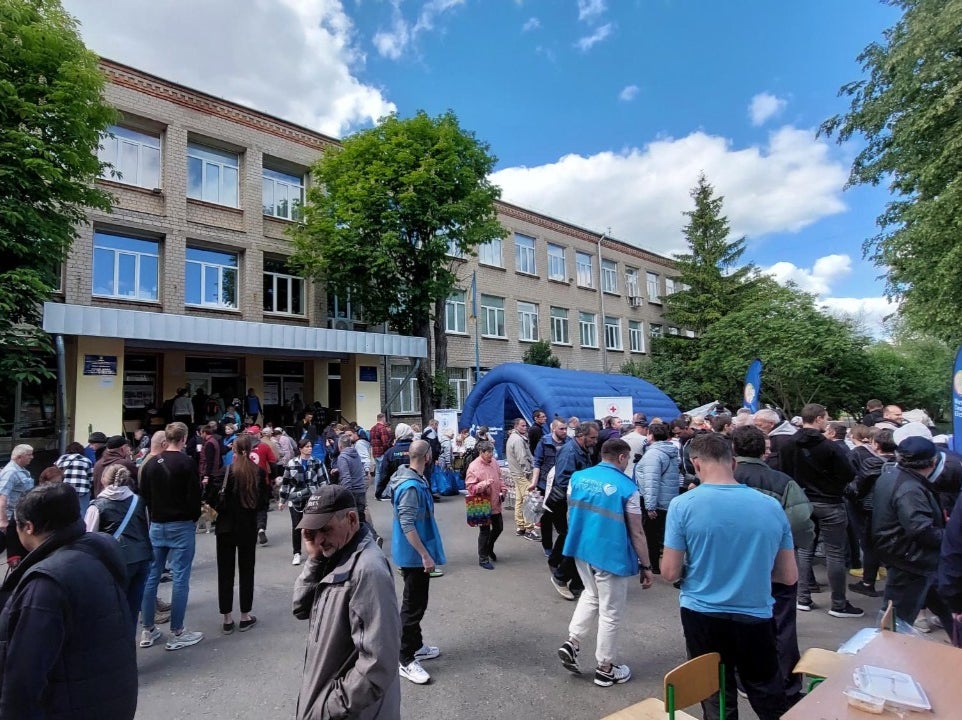 Dozens of evacuees arrive at the UNHCR’s transit centre in Kharkiv after fleeing their homes near the Russian border