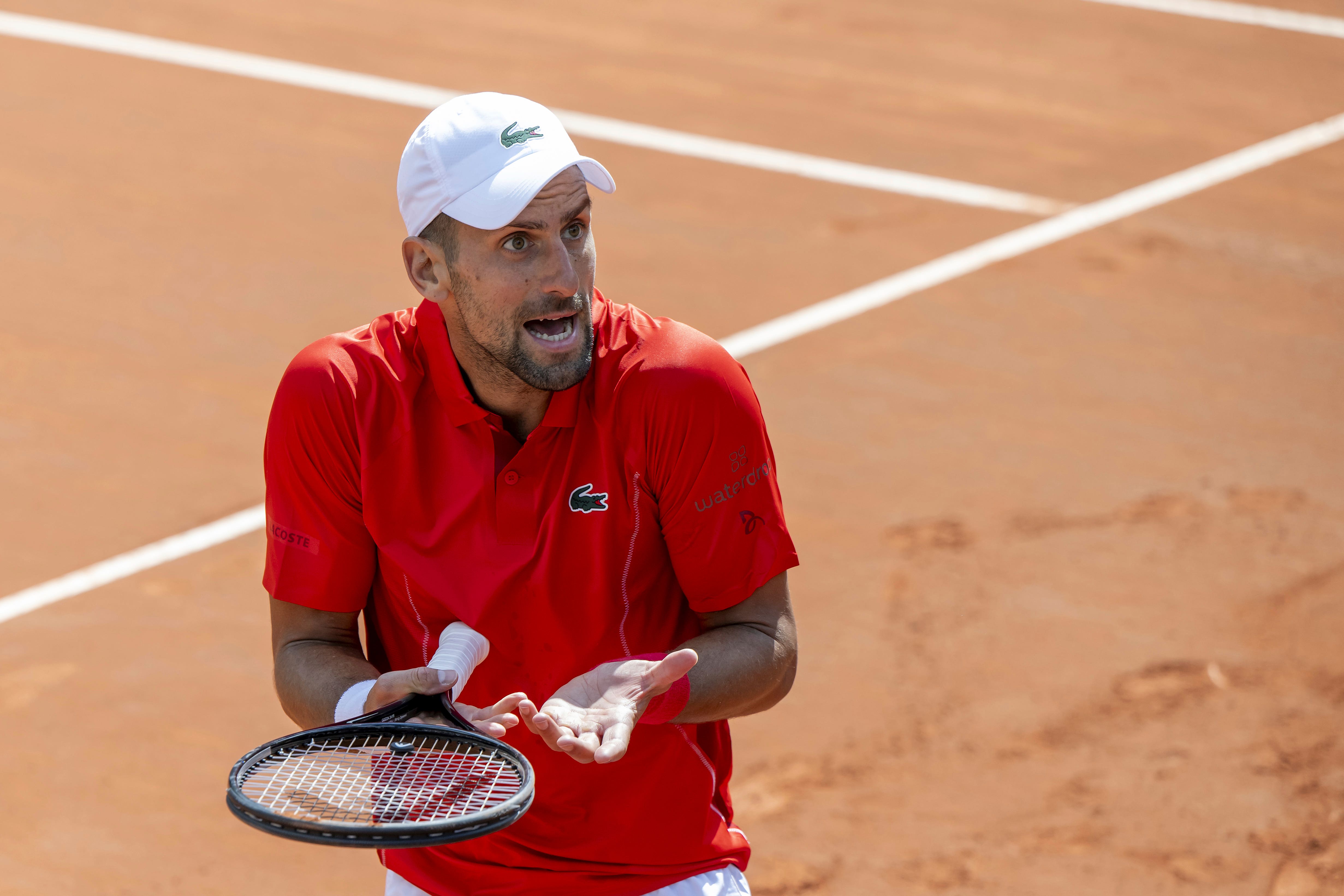 Novak Djokovic reacts after losing a point to Tomas Machac during his semi-final defeat at the Geneva Open in Switzerland (Martial Trezzini/Keystone via AP)