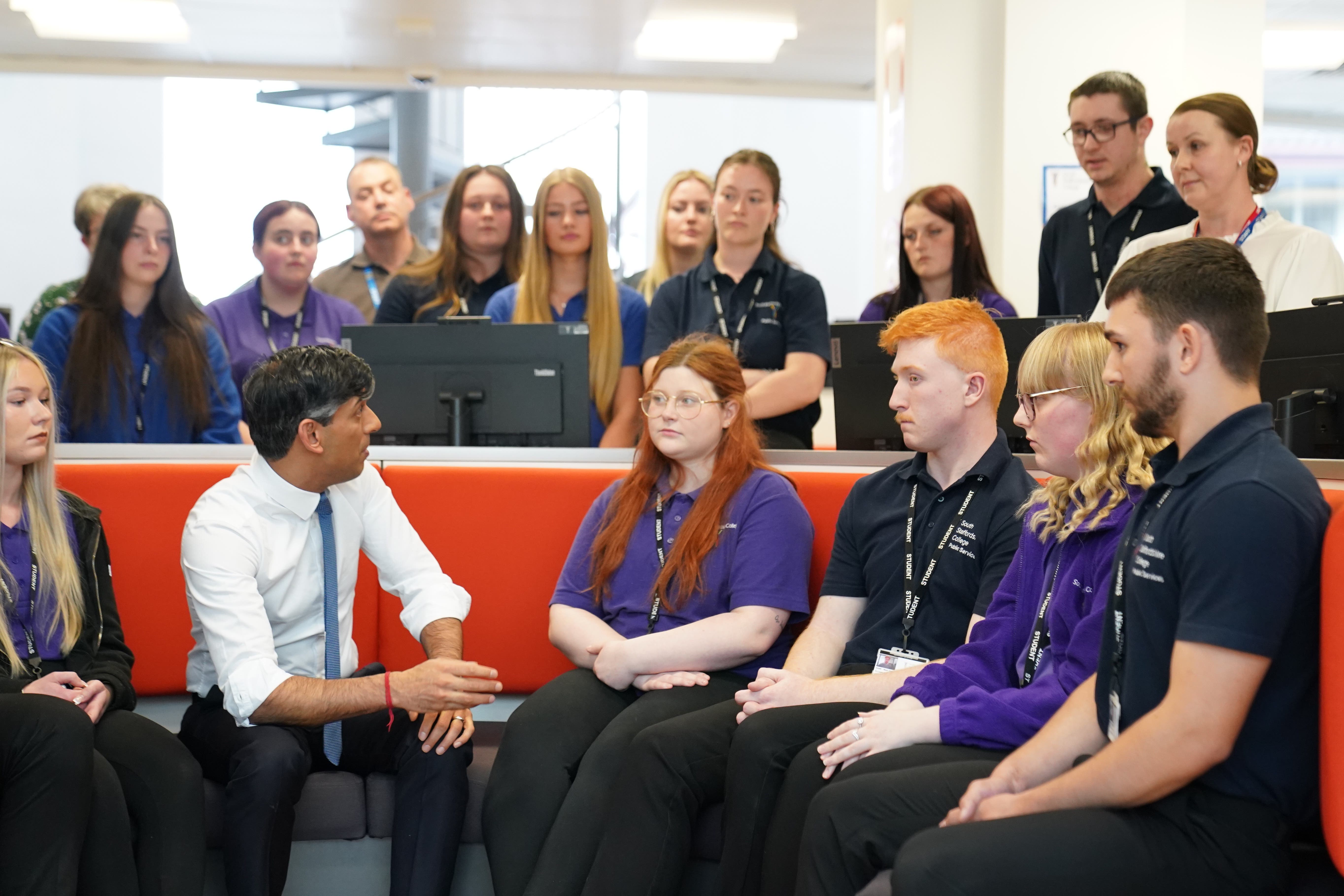 Prime Minister Rishi Sunak speaking to students and teachers including Jennifer Hughes during a visit to Cannock College (Stefan Rousseau/PA)