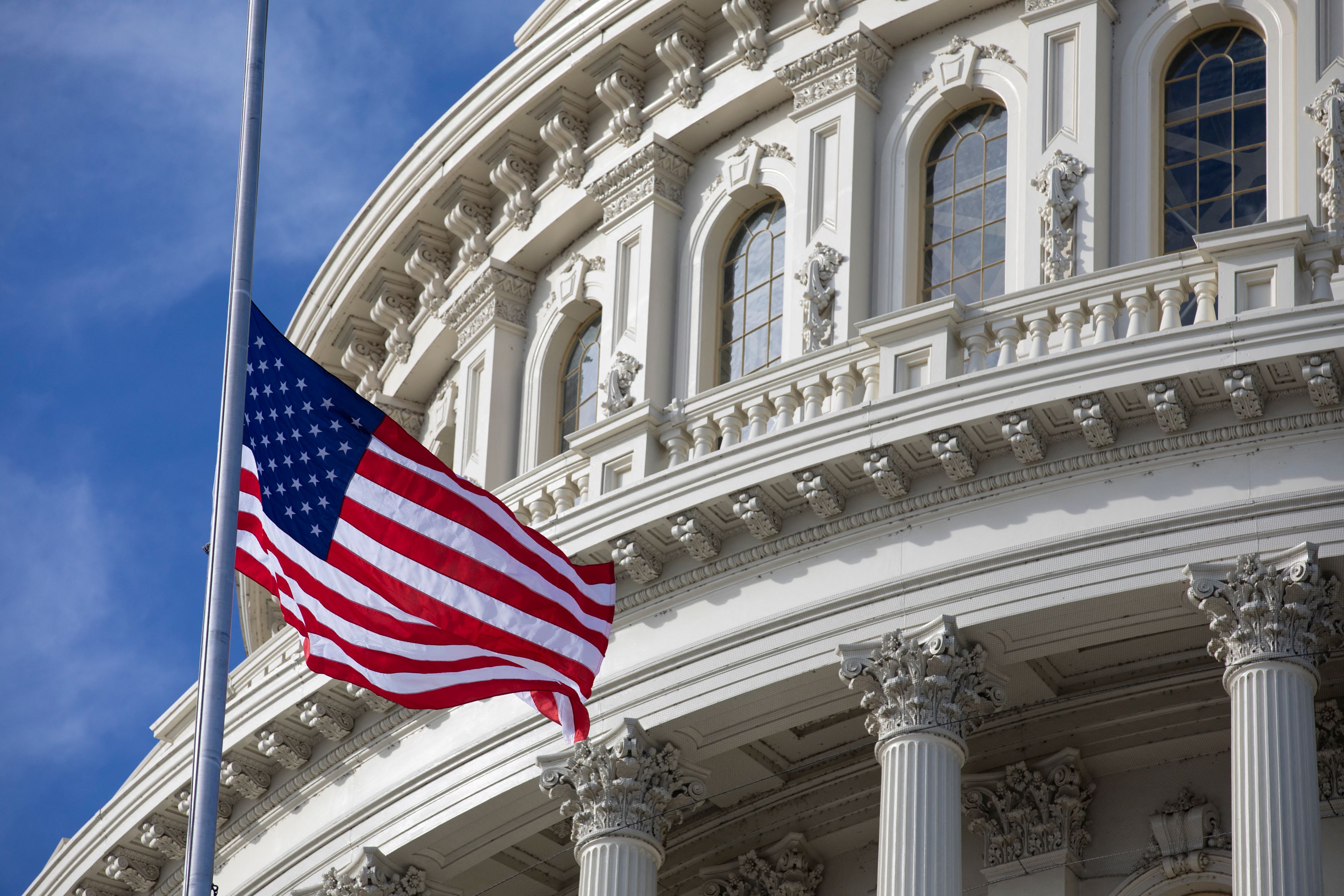 The US flag flies at half-staff in honor of former President George HW Bush outside the US Capitol in Washington, DC on 3 December, 2018