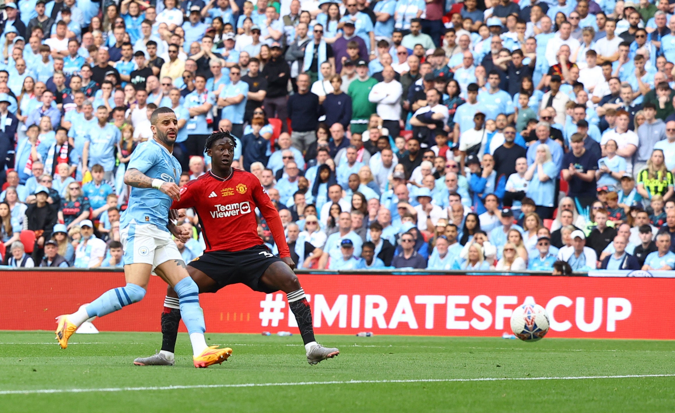 Kobbie Mainoo slides home United’s second goal