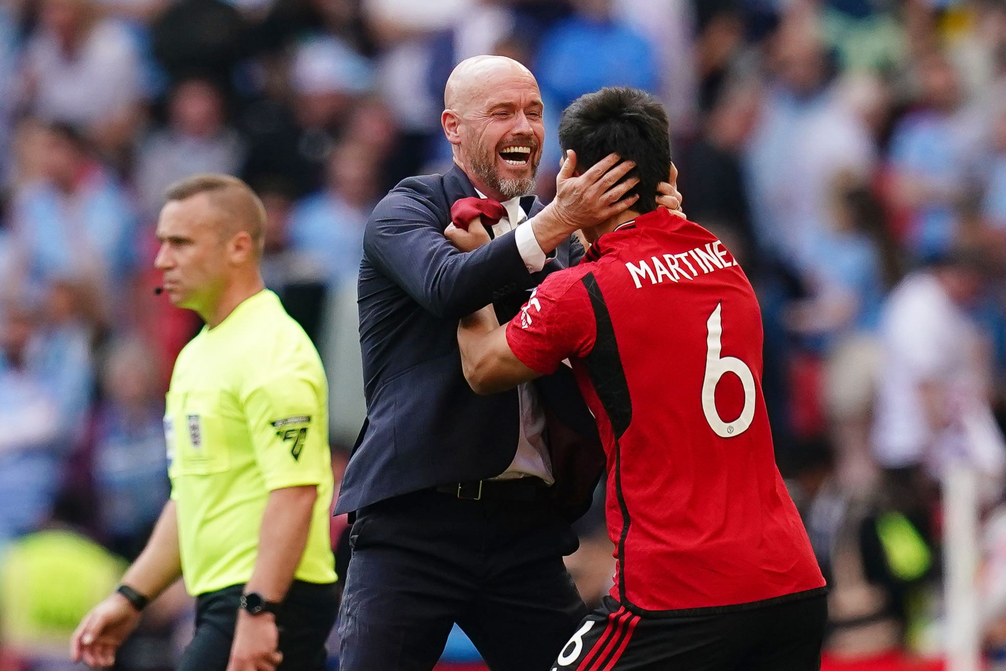 Erik ten Hag celebrates with Lisandro Martinez (right) at the final whistle (John Walton/PA)