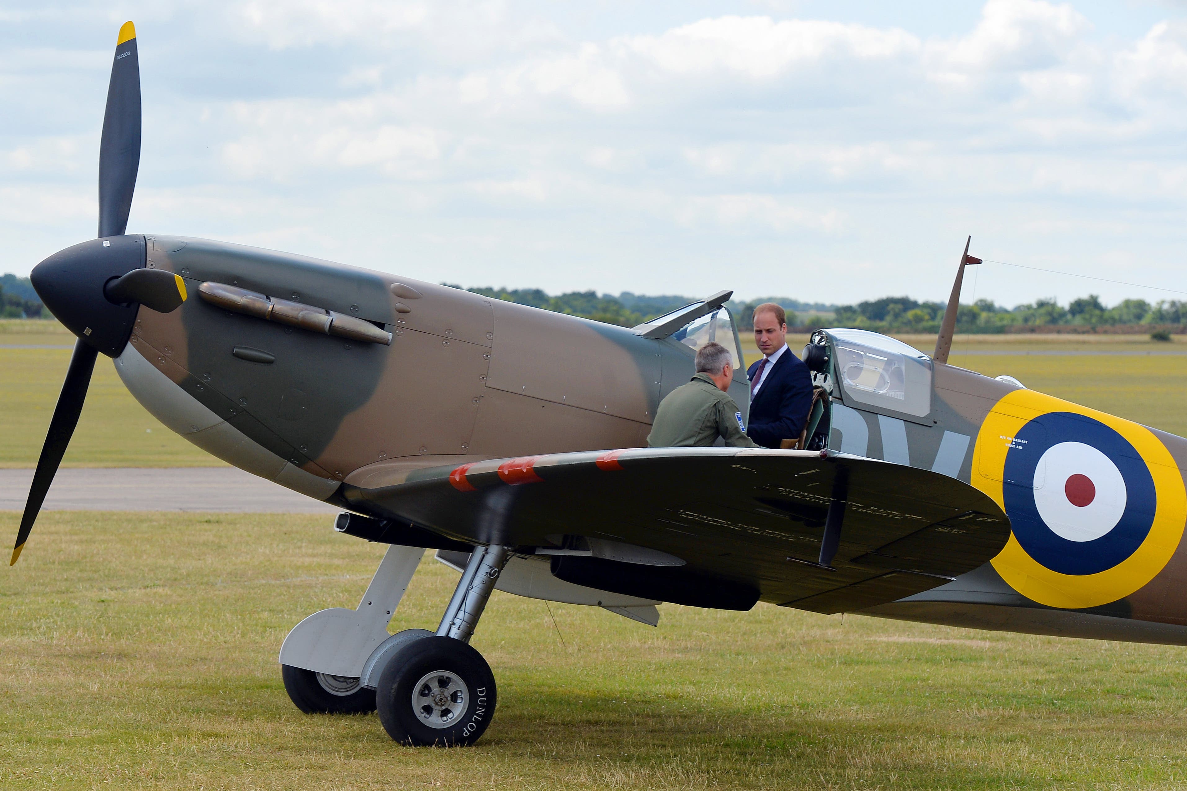 The Prince of Wales sits in a Spitfire at the Imperial War Museum in Duxford, Cambridge