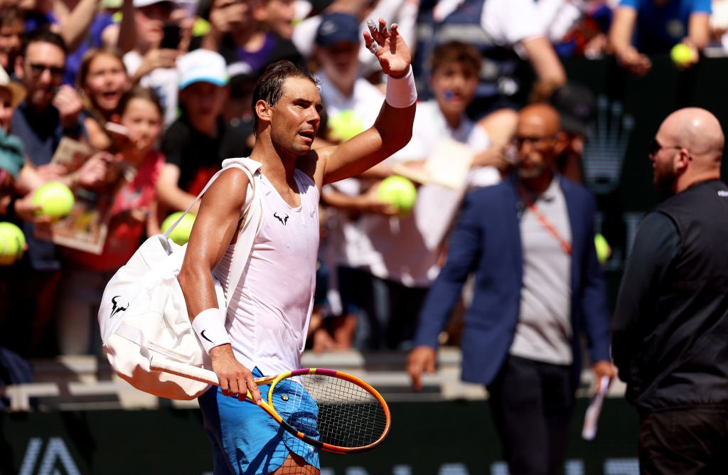 Nadal waves to the crowd during a practice session at Roland Garros