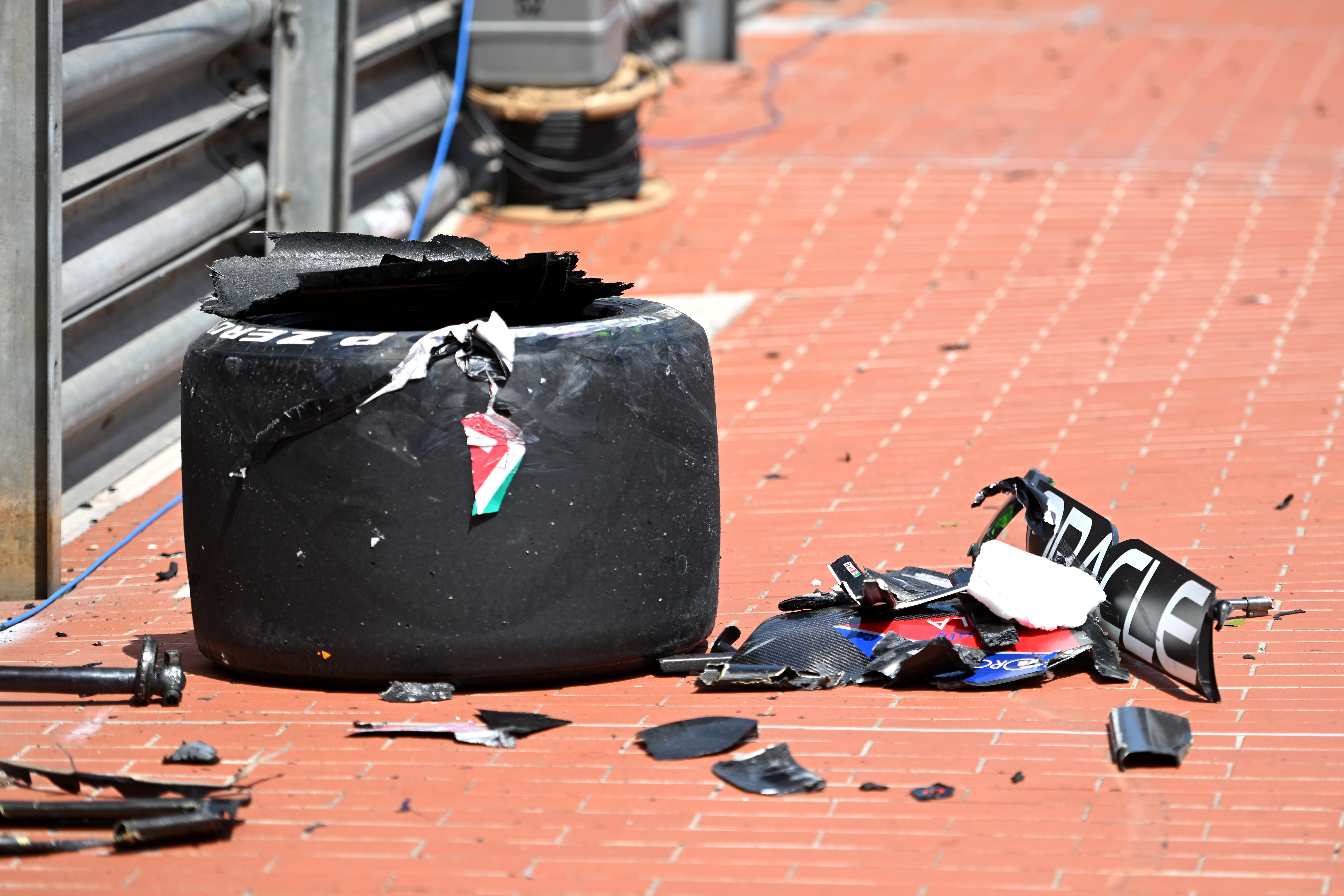 One of Perez’s tyres flew over the fence and onto the pavement