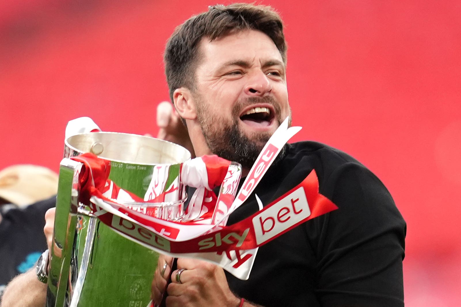 Southampton manager Russell Martin celebrates his side’s promotion after beating Leeds in the play-off final (Adam Davy/PA)