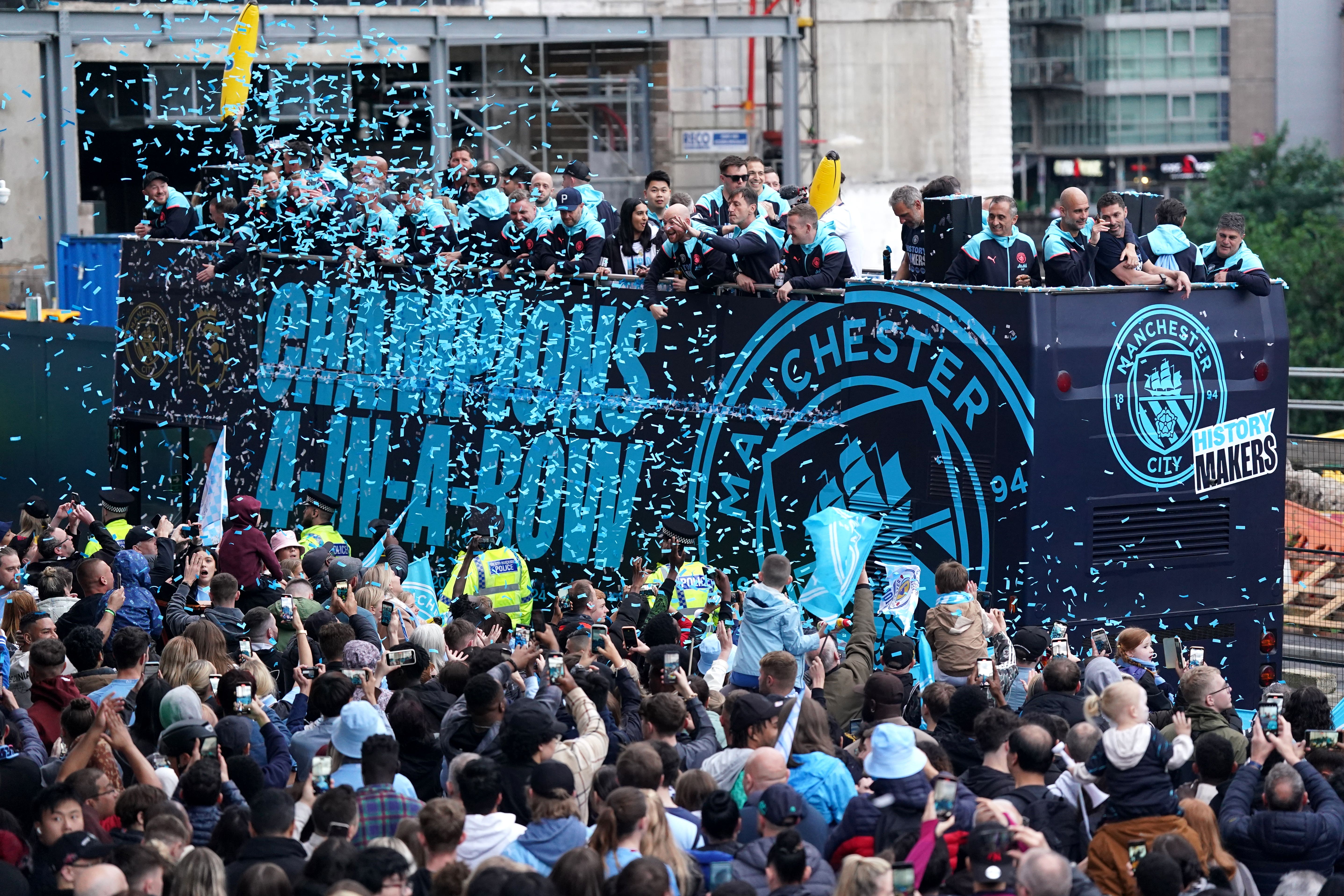 Pep Guardiola and his Manchester City side celebrate their Premier League trophy success (Bradley Collyer/PA).