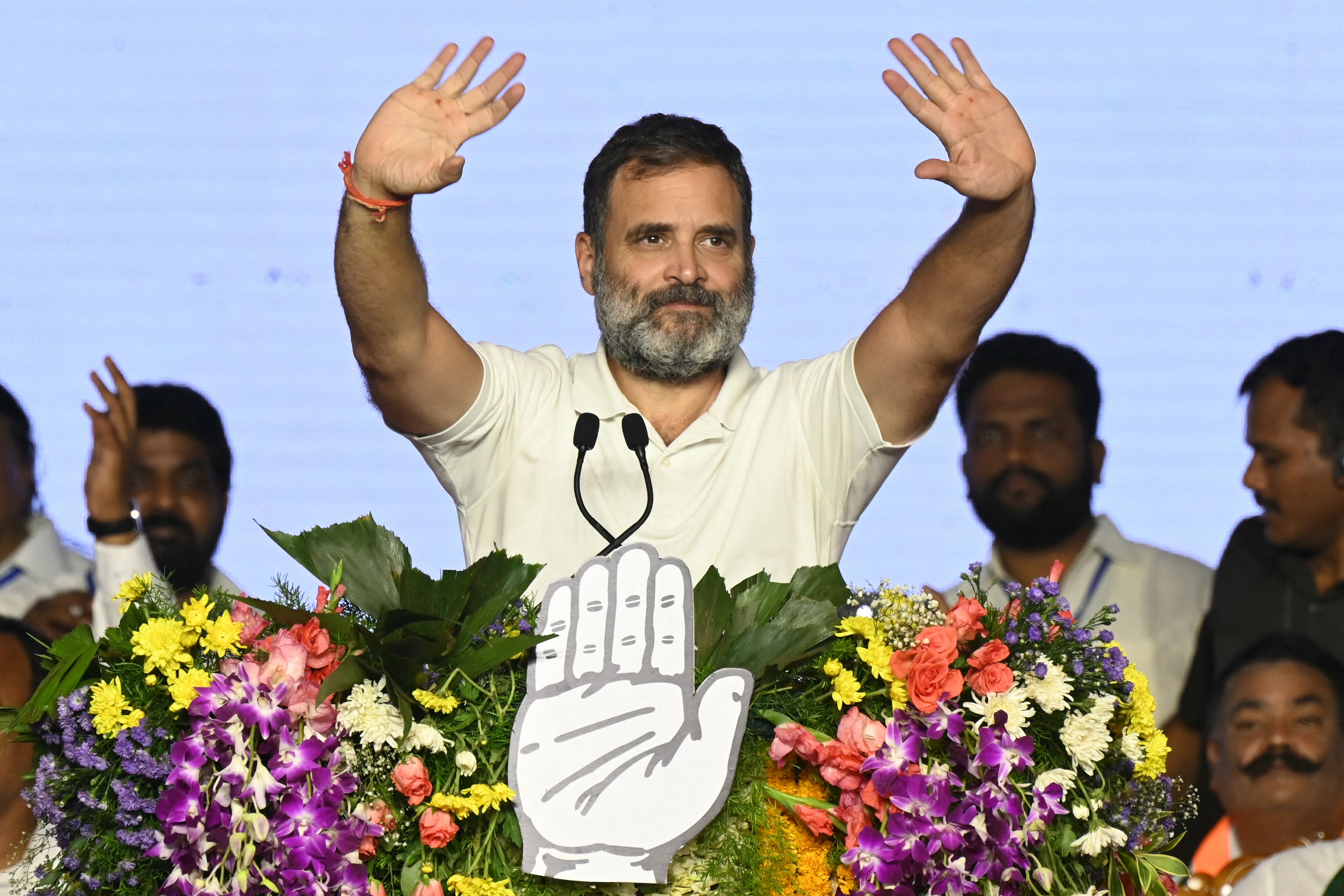 Rahul Gandhi waves to supporters during an election campaign public meeting in Rae Bareli