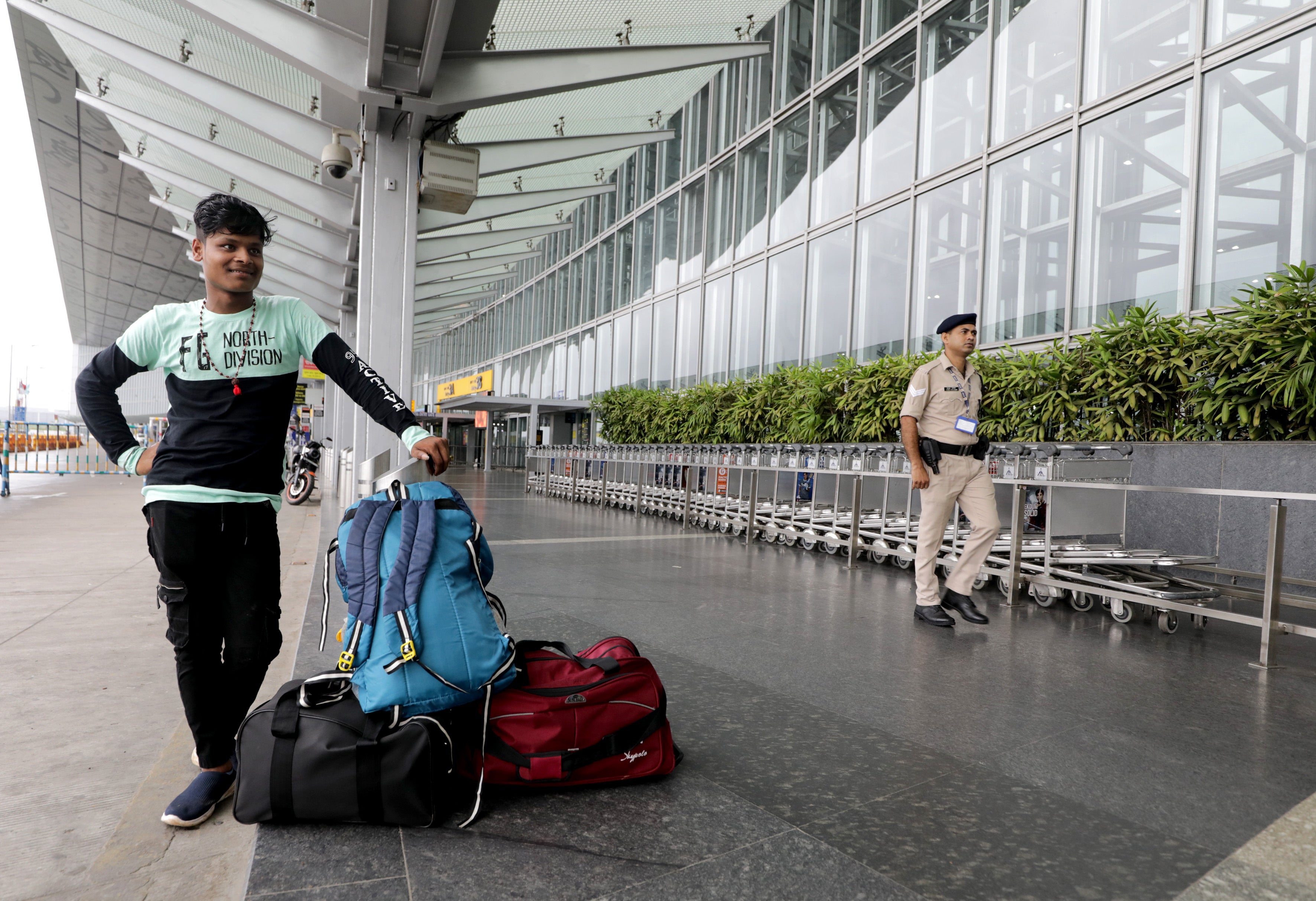 A man waits as flights are suspended at Netaji Subhas Chandra Bose airport due to an approaching cyclone in Kolkata, India 26 May 2024