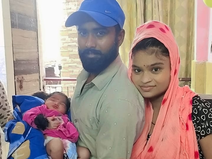 Newborn baby Ruhi, pictured here before the fire at home with her parents, is one of seven killed in the blaze