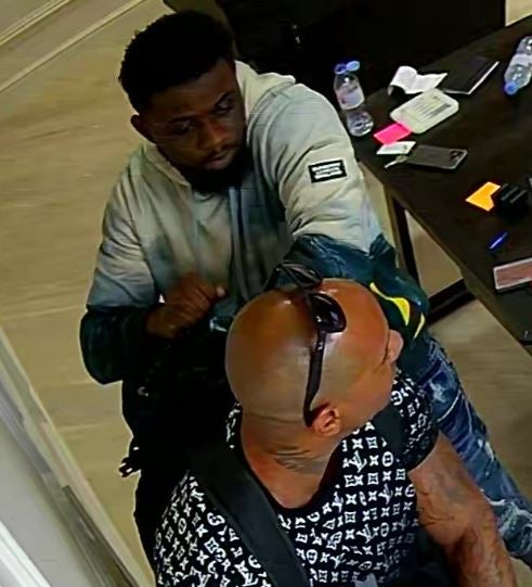 The two men officers wish to speak to in connection with the robbery