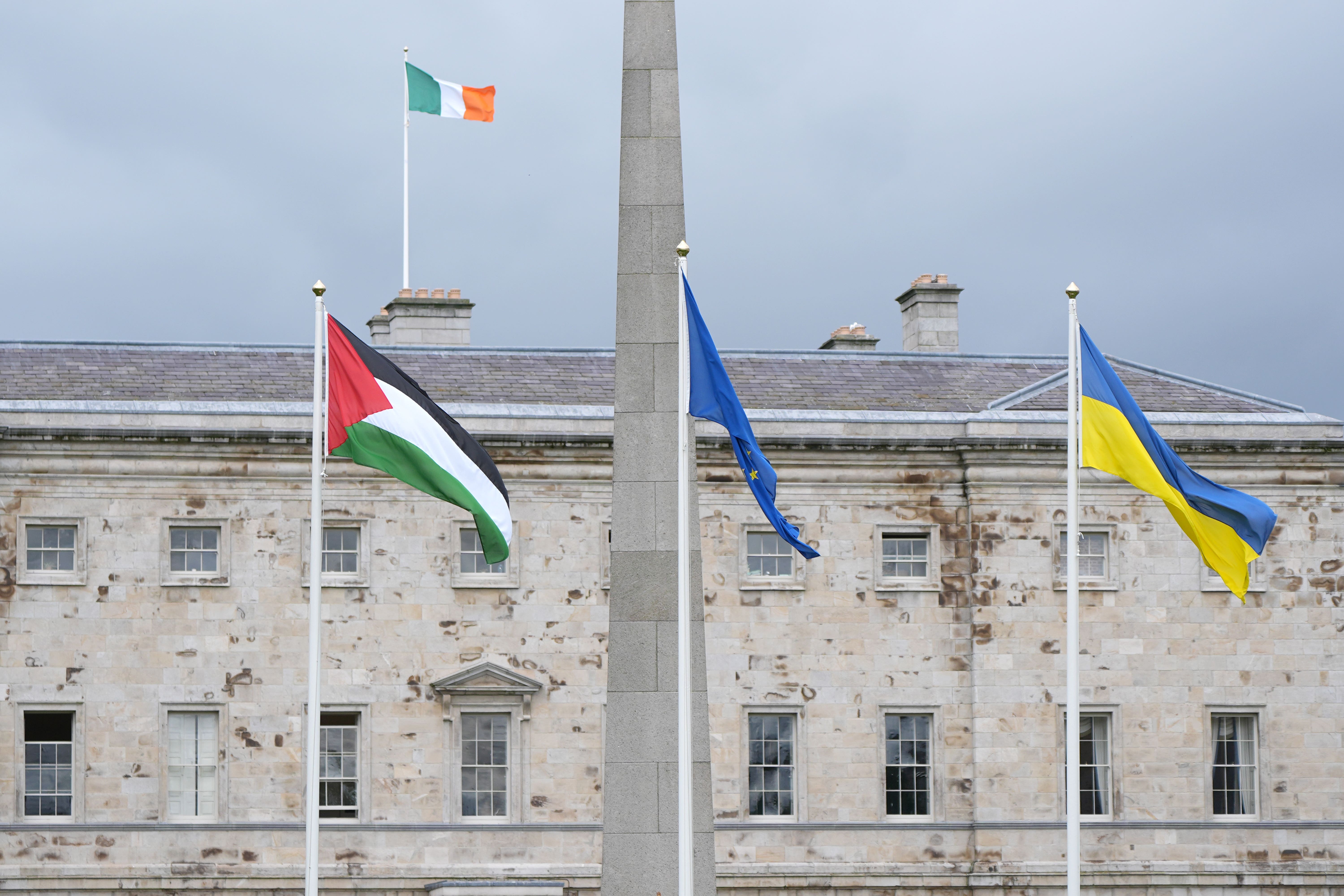 The flag of Palestine (left) flying outside Leinster House, Dublin (PA)