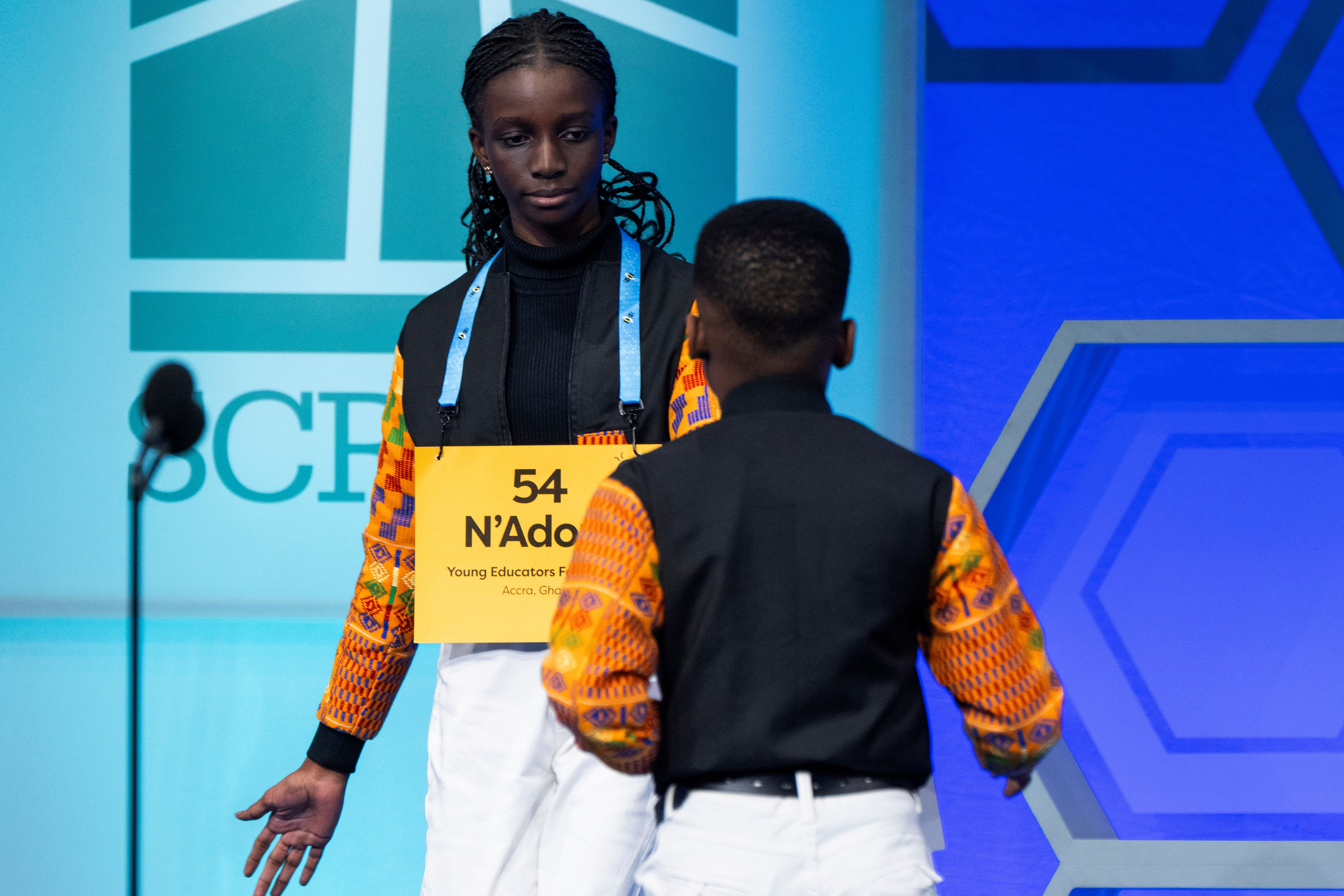 N'Adom Darko-Asare, 13, of Accra, Ghana, left, congratulates Giovanni Adjei, 10, of Accra, Ghana, during competition in the Scripps National Spelling Bee