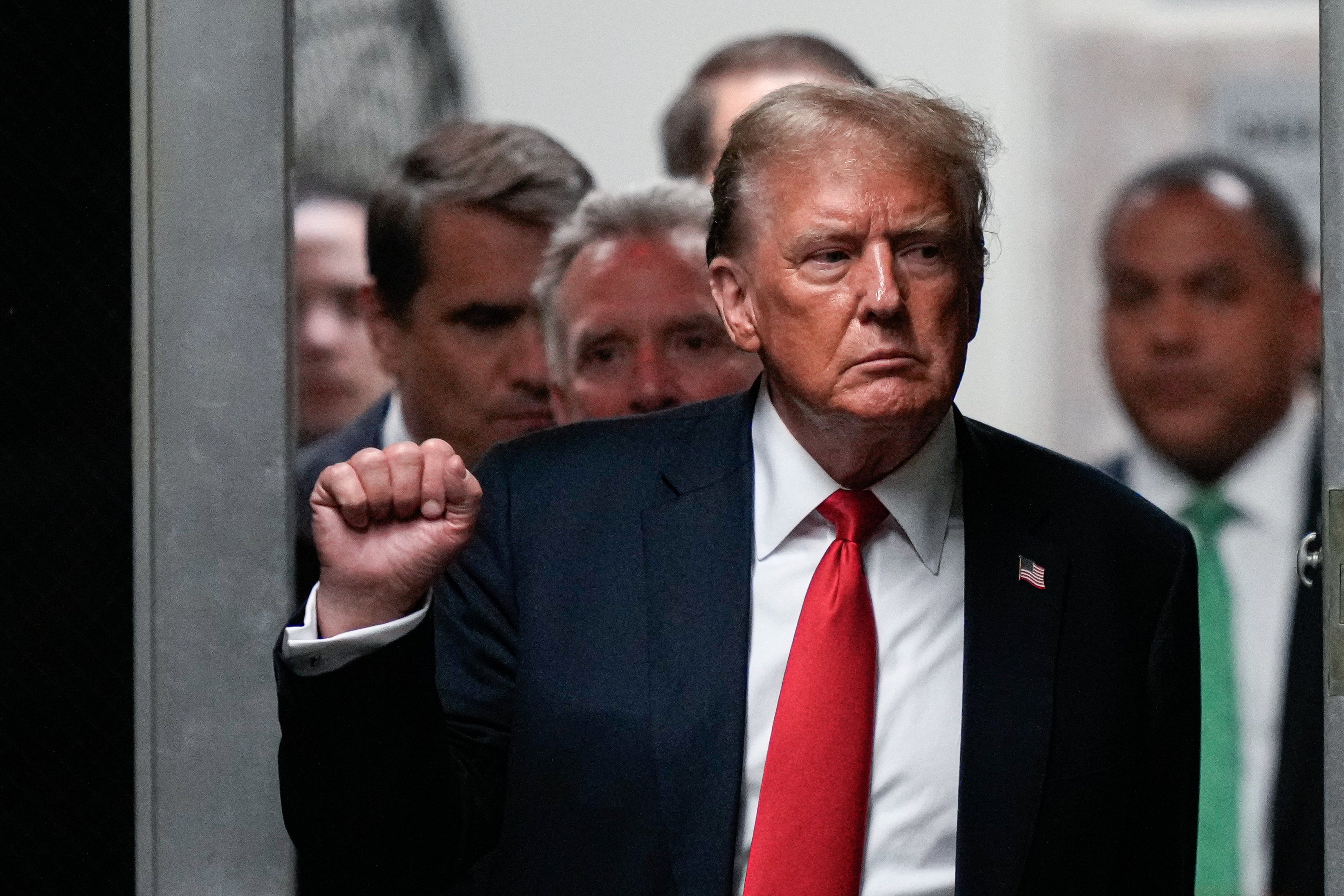 Donald Trump leave a Manhattan courtroom where attorneys delivered closing arguments in his hush money trial on May 28.