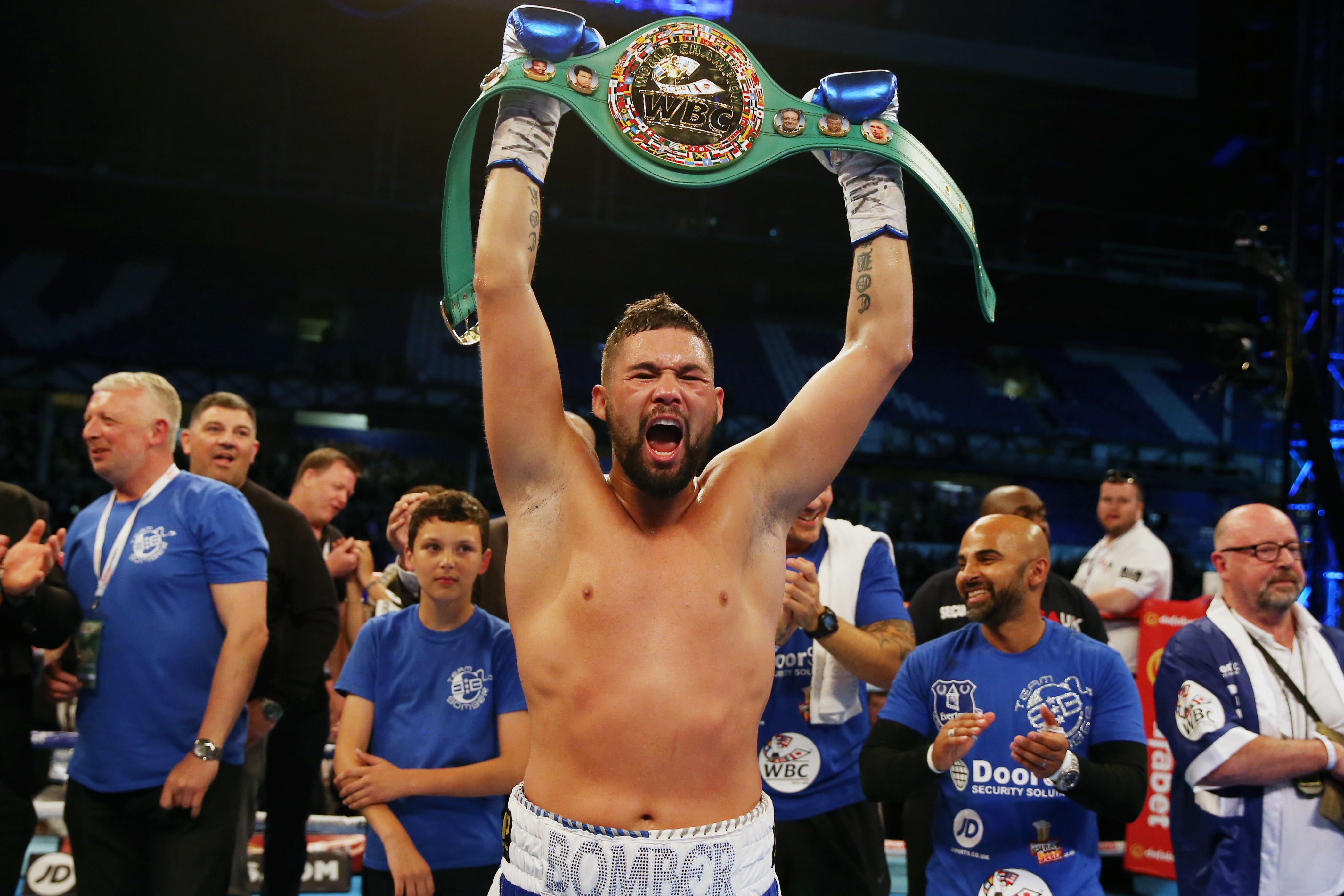 Tony Bellew celebrates with the WBC Cruiserweight World Championship belt after beating Ilunga Makabu (Martin Rickett/PA)