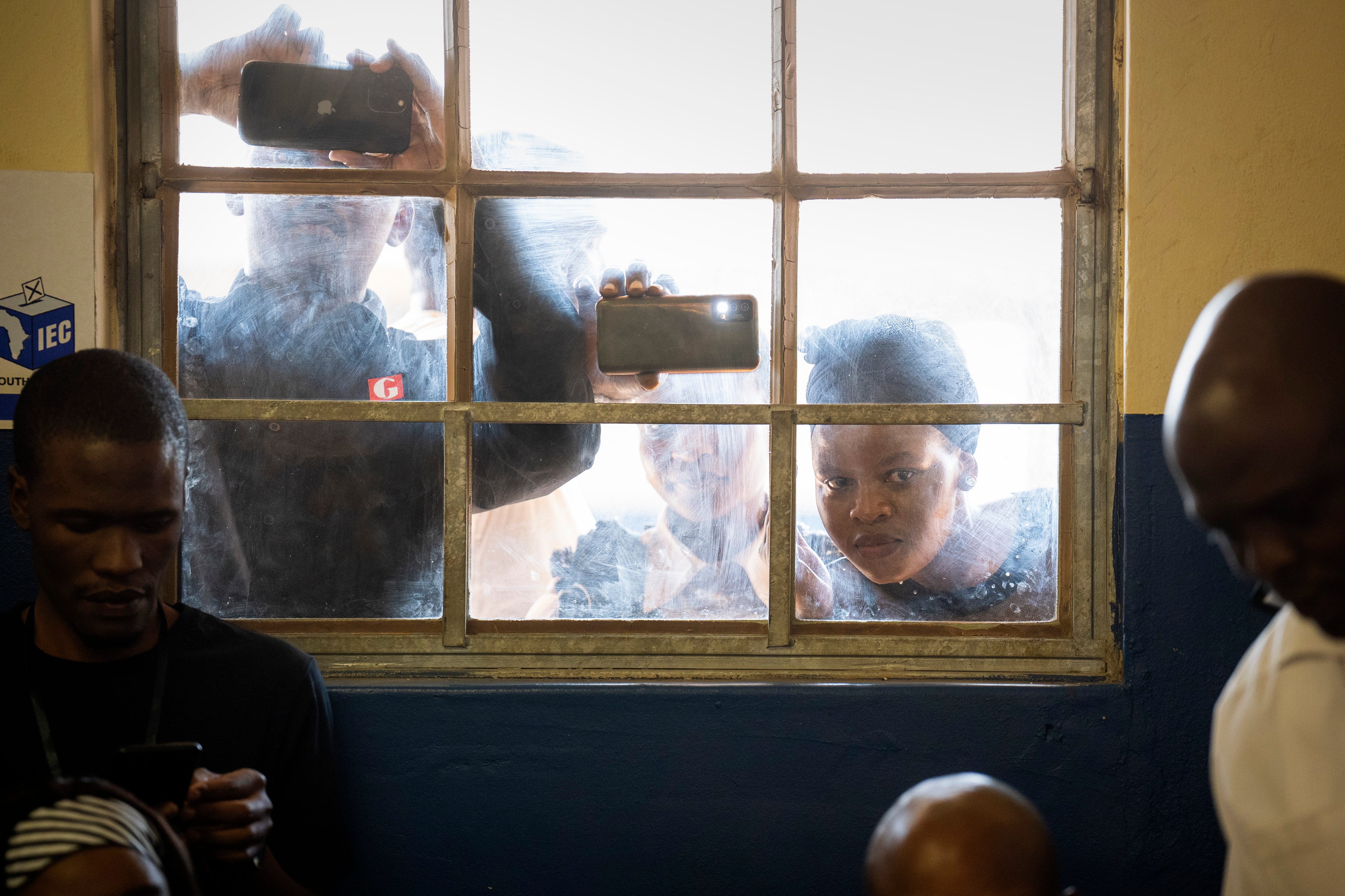 People watch as ex-president Jacob Zuma votes Nkandla, Kwazulu Natal