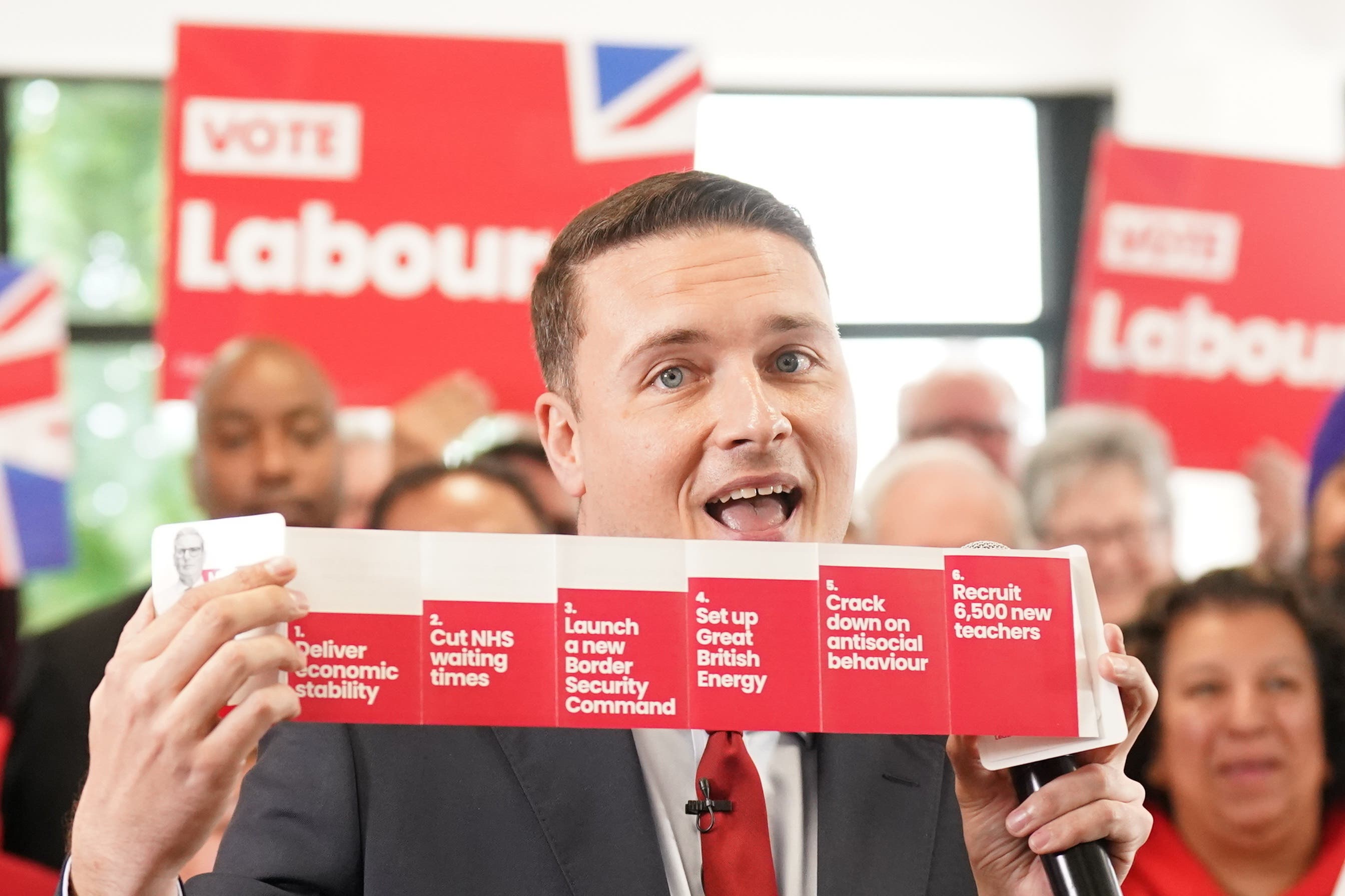 Shadow health secretary Wes Streeting with a booklet containing Labour six General Election pledges (Stefan Rousseau/PA)