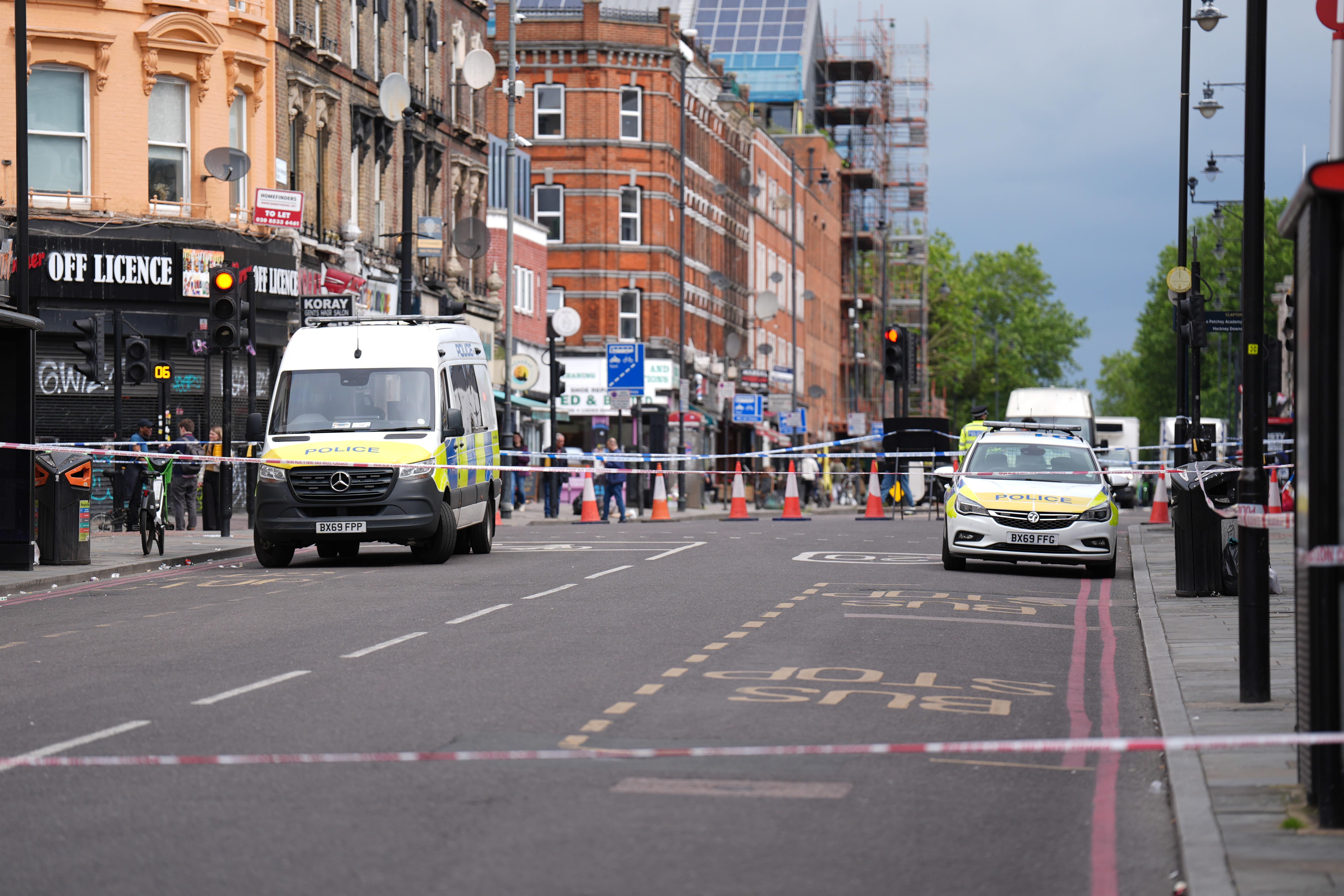 Police at the scene of the shooting in Kingsland High Street, Hackney, east London (James Manning/PA)