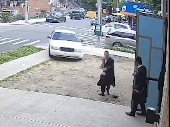 A driver accelerates towards pedestrians at Mesivta Nachlas Yakov School in New York City on 29 May