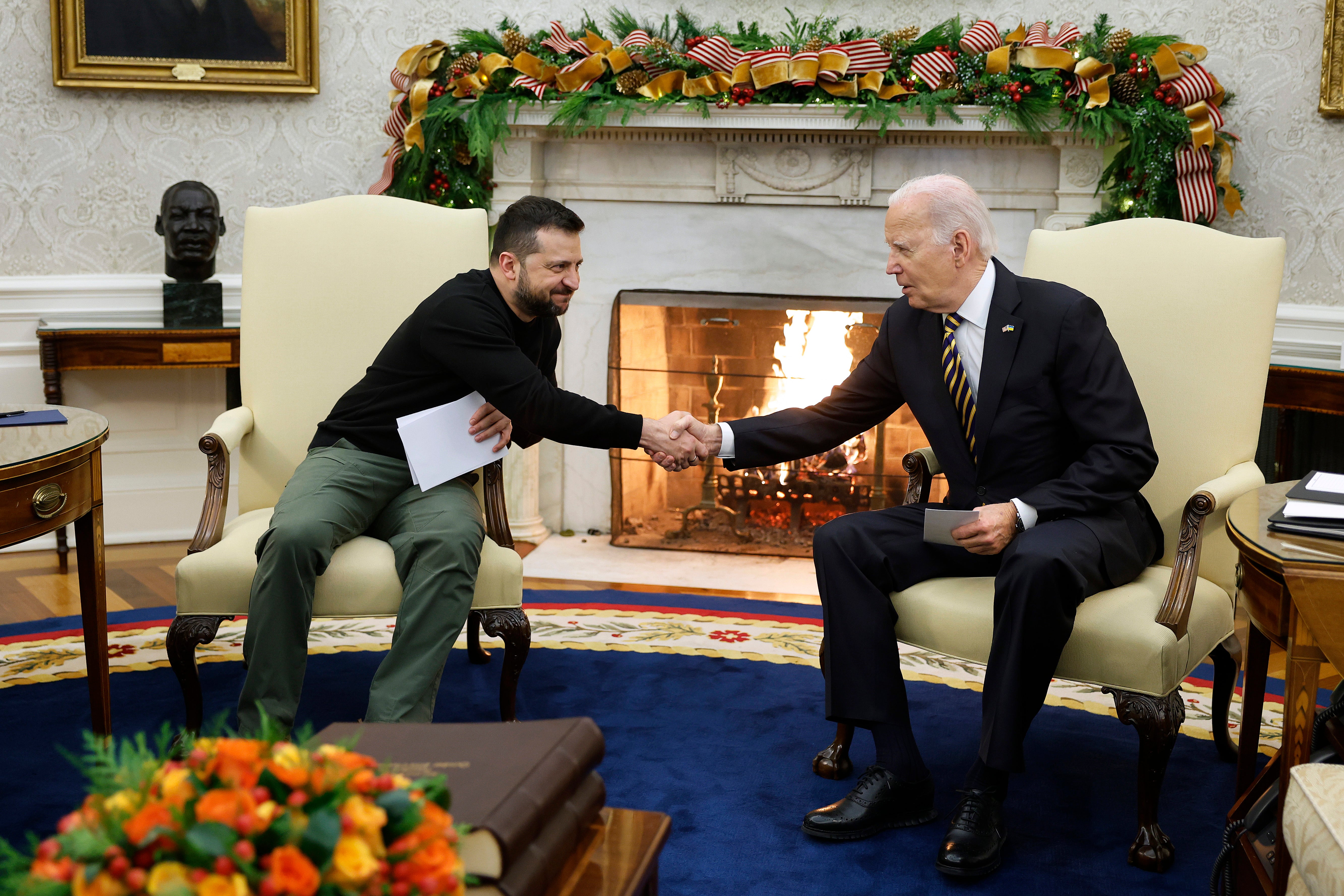 Volodymyr Zelensky and Joe Biden shake hands on December 12, 2023 in Washington, DC