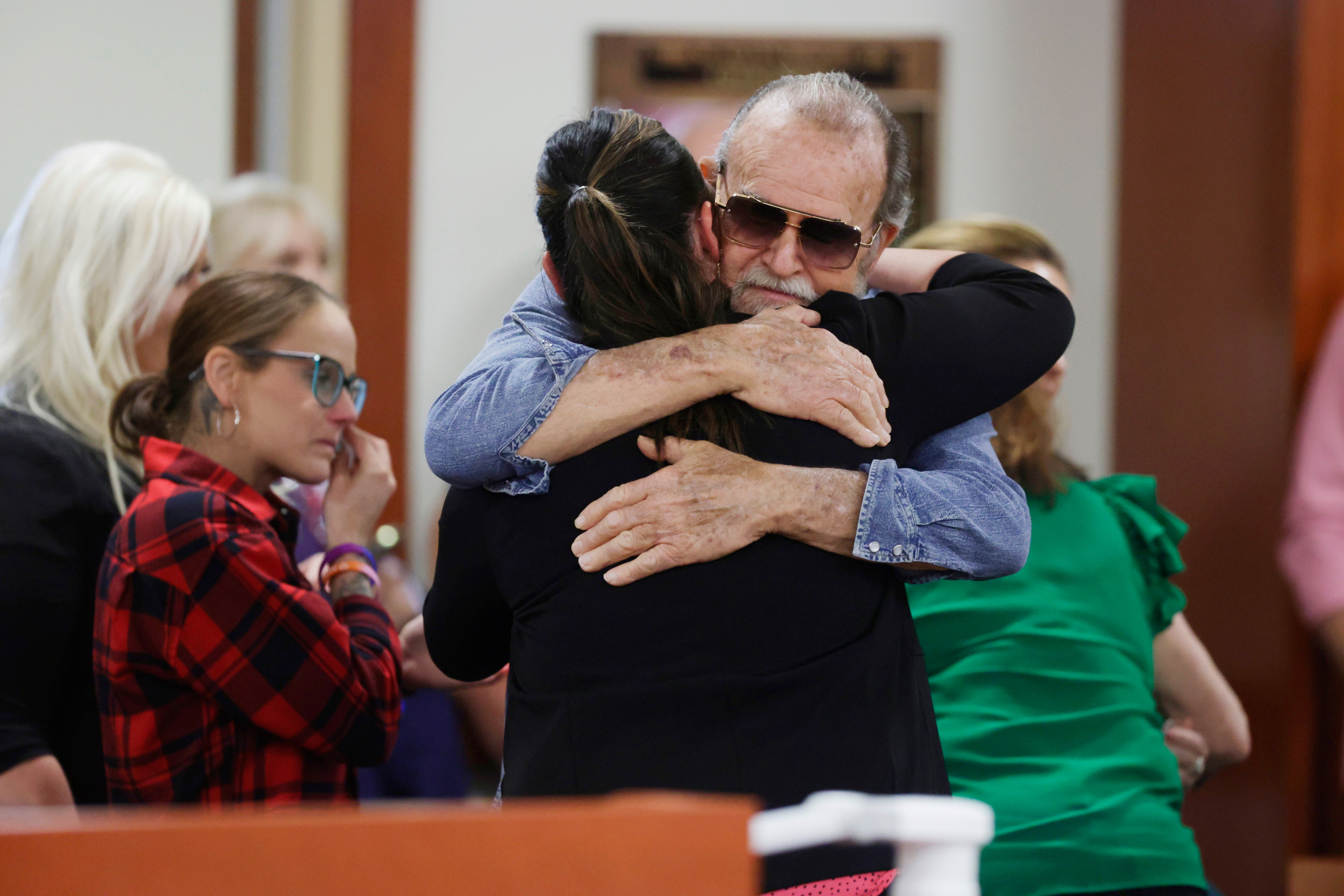 Larry Woodcock, the grandfather of slain JJ Vallow, gets a hug after the verdict in the Chad Daybell murder trial was read at the Ada County Courthouse in Boise, Idaho, on May 30, 2024