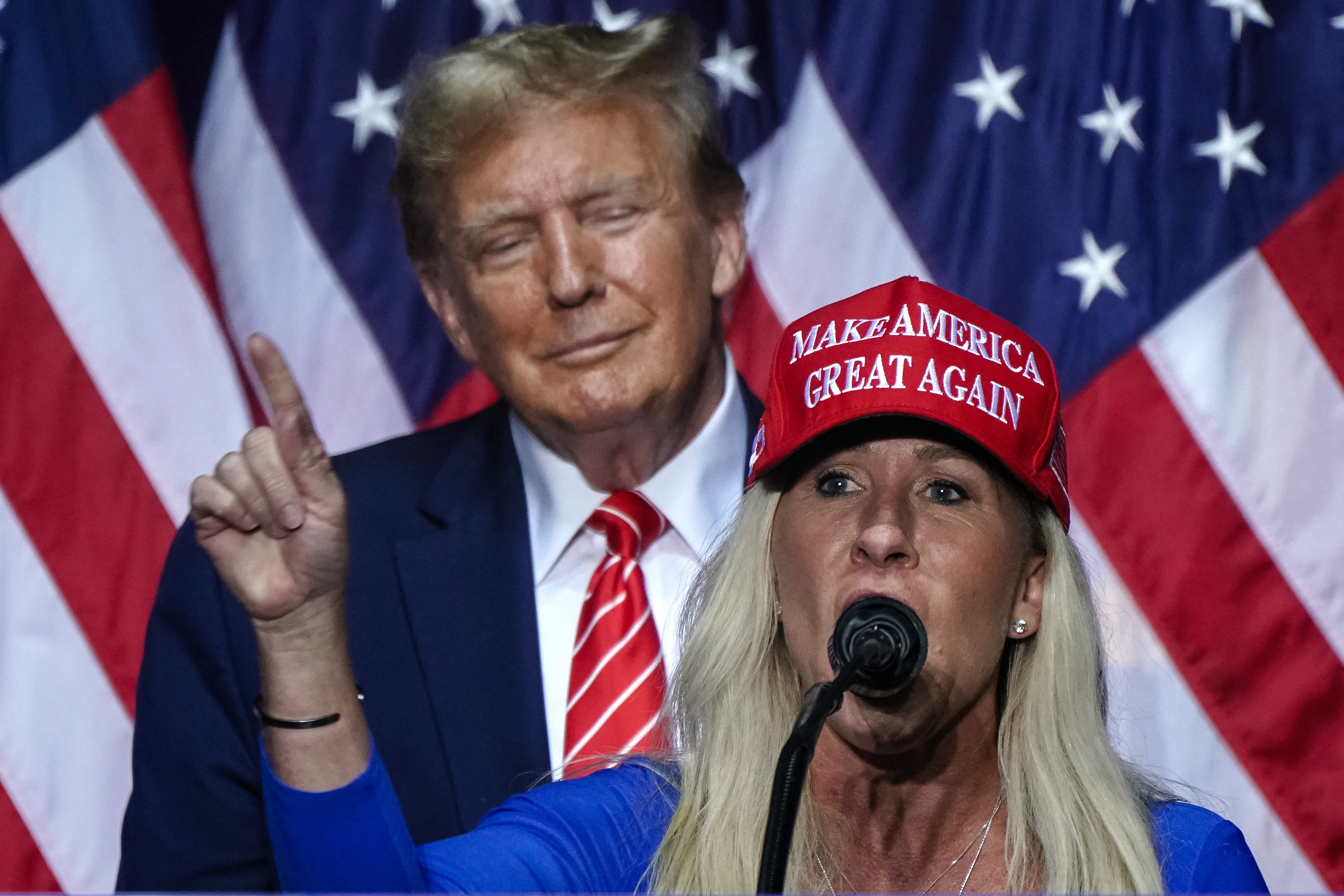 Marjorie Taylor Greene posted a picture of an upside down flag in the wake of Former President Donald J Trump’s conviction on Thursday. They are pictured together in March.