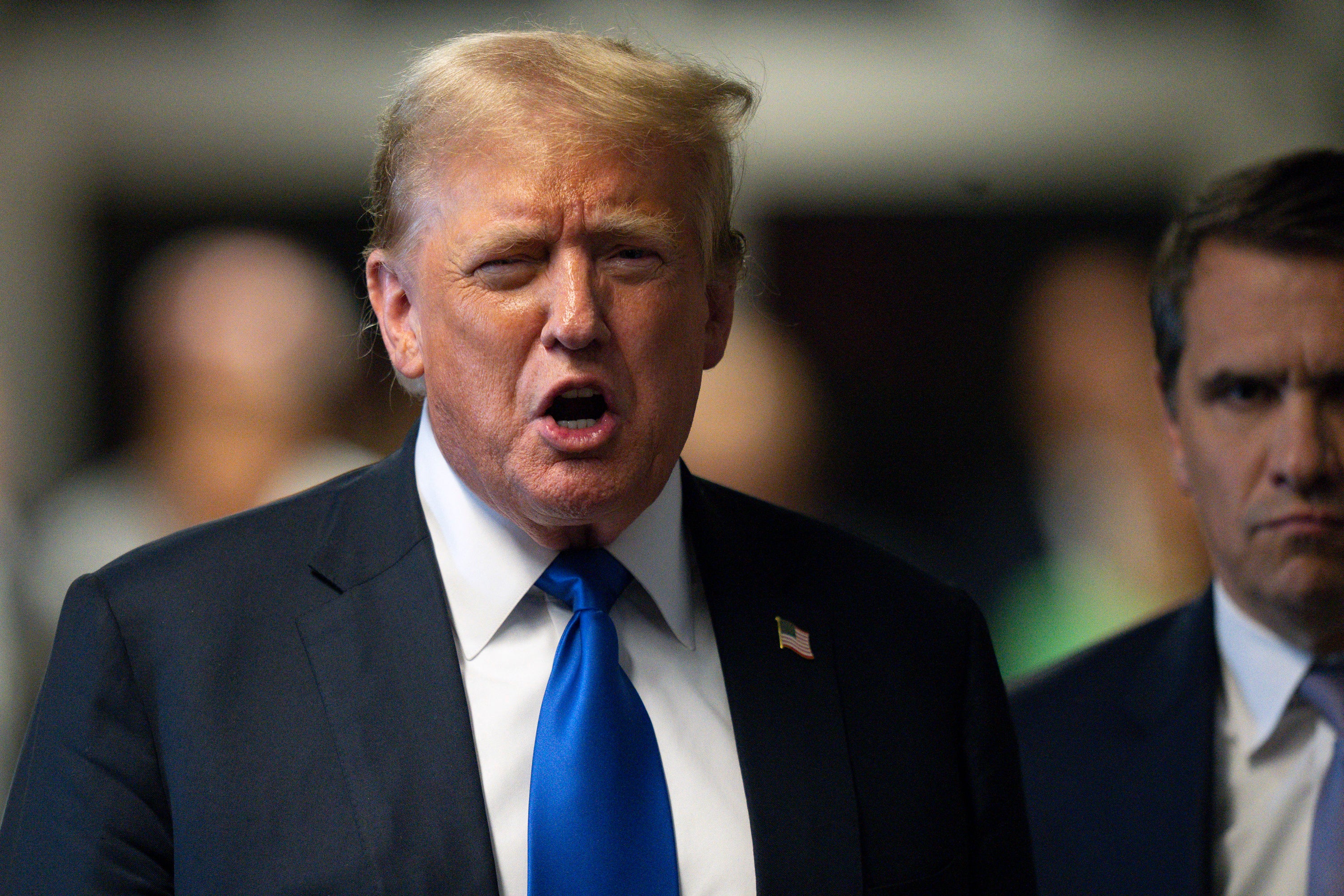 Donald Trump speaks to the press, flanked by attorney Todd Blanche, after he was convicted in his criminal trial