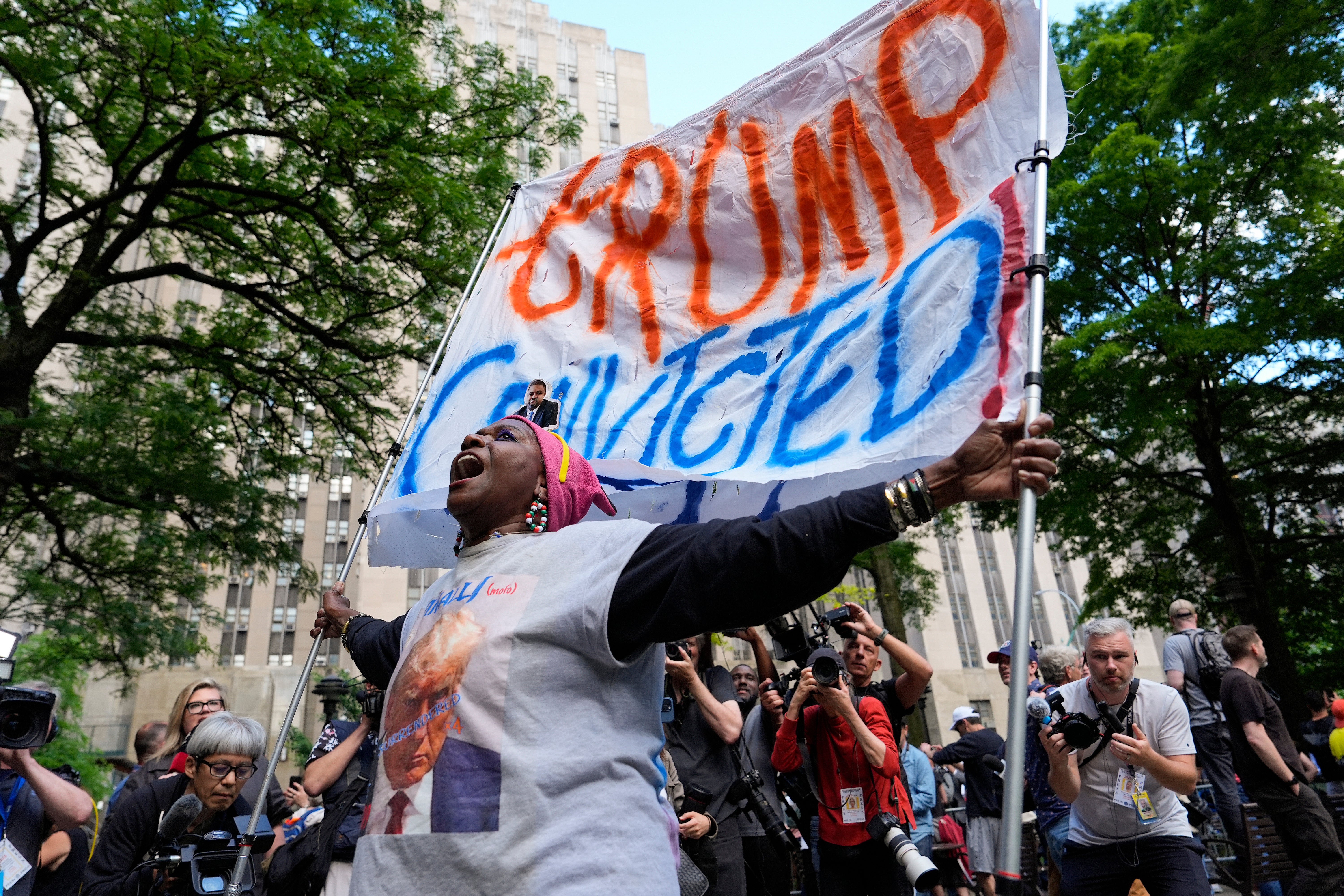 A demonstrator reacts to the guilty verdict announced against former president Donald Trump on Thursday