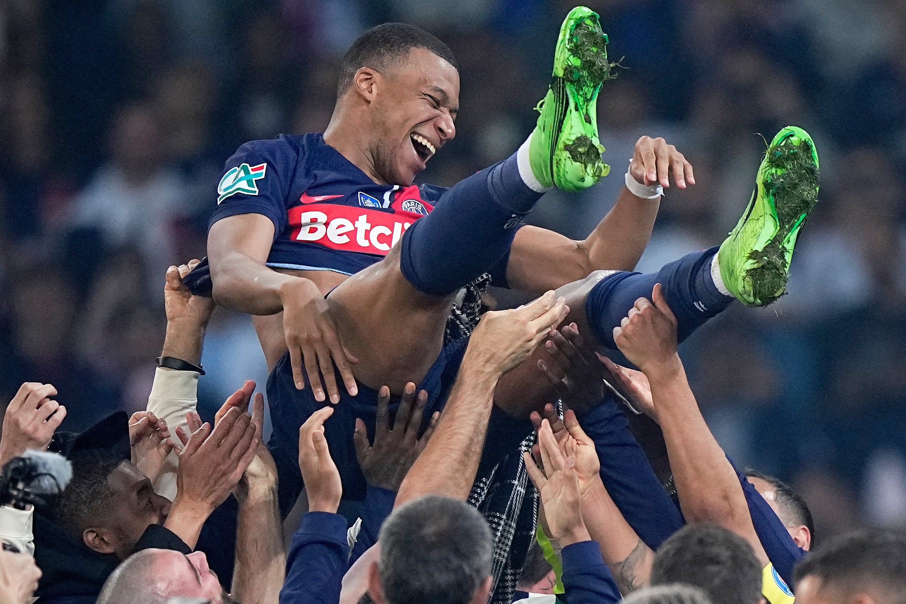 Mbappe is tossed in the air as PSG celebrate winning the French Cup in his last game