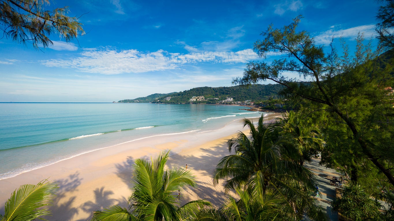 The sand of Patong Beach in Phuket awaits