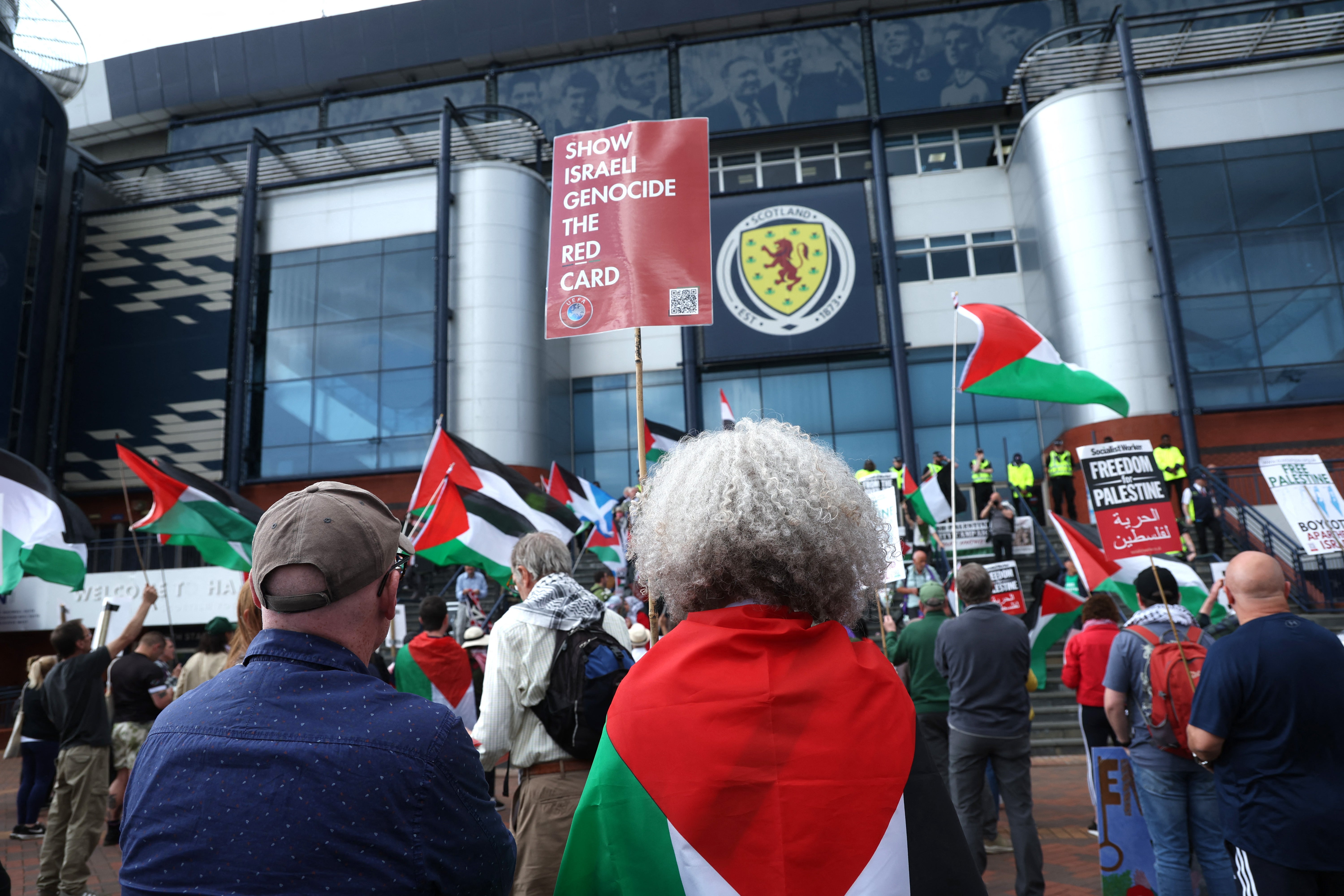 Protesters arrive at Hampden Park where Scotland Women face Israel in a Euro 2025 qualifier.