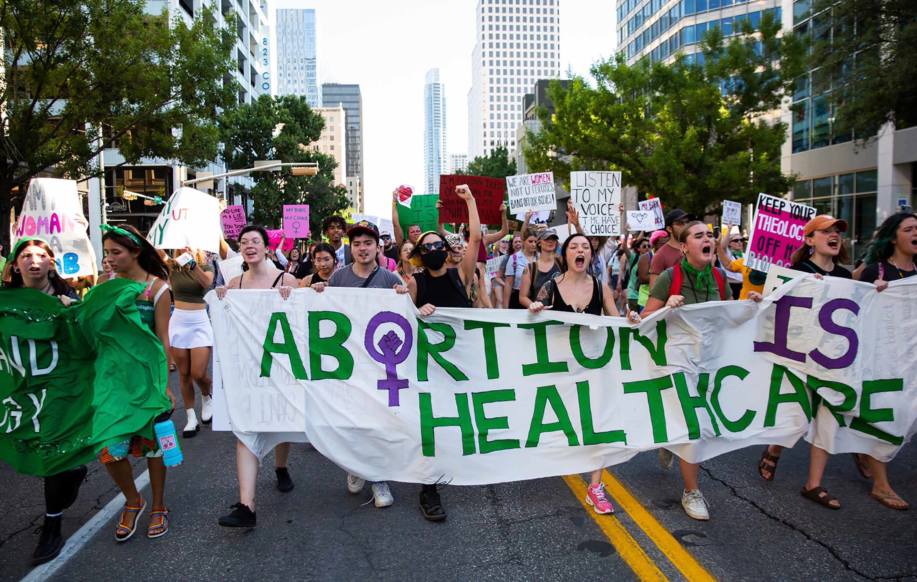 Abortion rights protesters march in Austin, Texas following the US Supreme Court’s decision to revoke a constitutiona right to abortion care in June 2022.