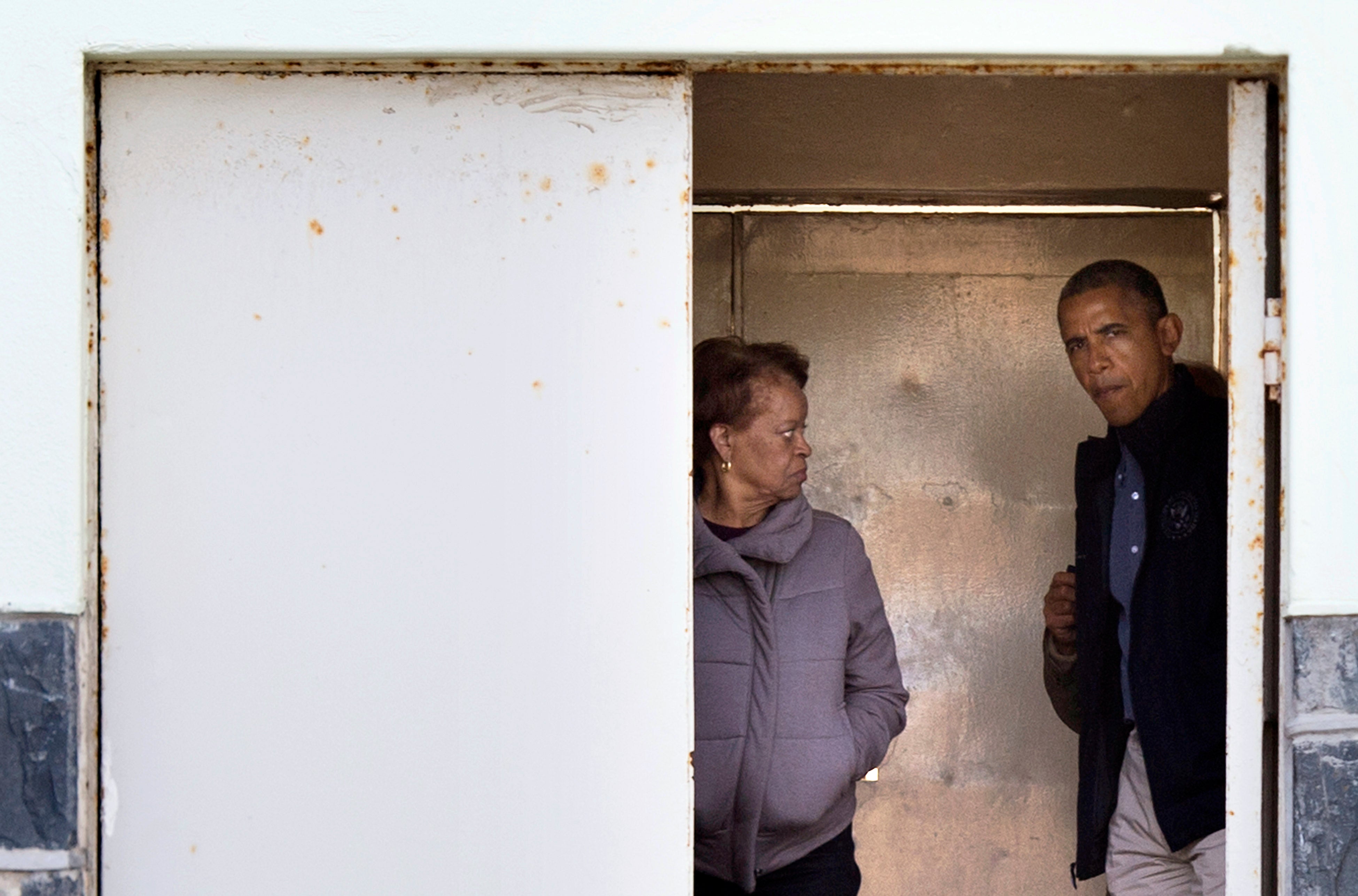 Barack Obama and Marian Robinson arrive on June 30, 2013 for a tour of Robben Island where where South-African anti-apartheid activist Nelson Mandela was once jailed.