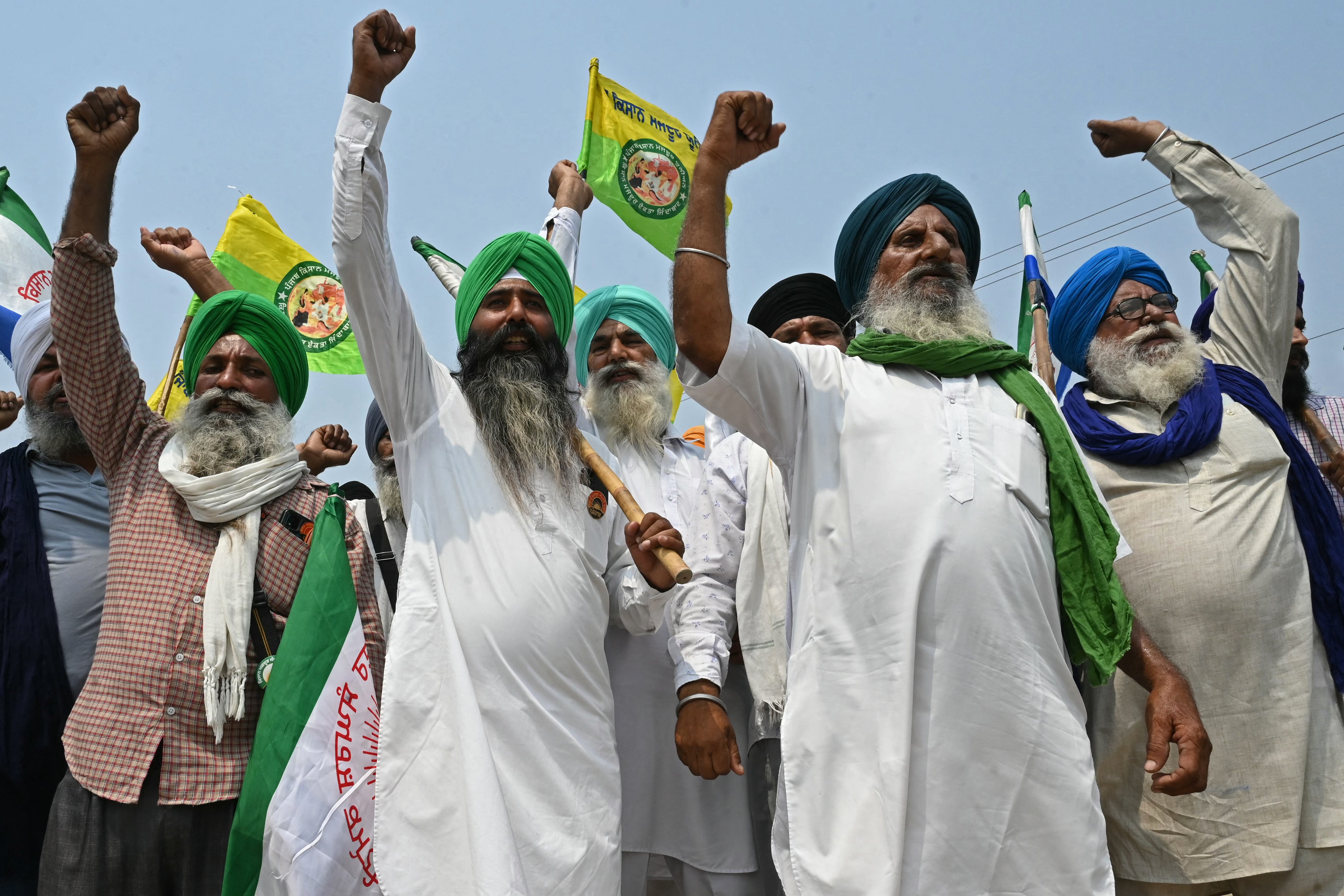 Farmers shout slogans against India’s Prime Minister and leader of the ruling Bharatiya Janata Party (BJP) Narendra Modi, during a protest to demand minimum crop prices on the outskirts of Gurdaspur