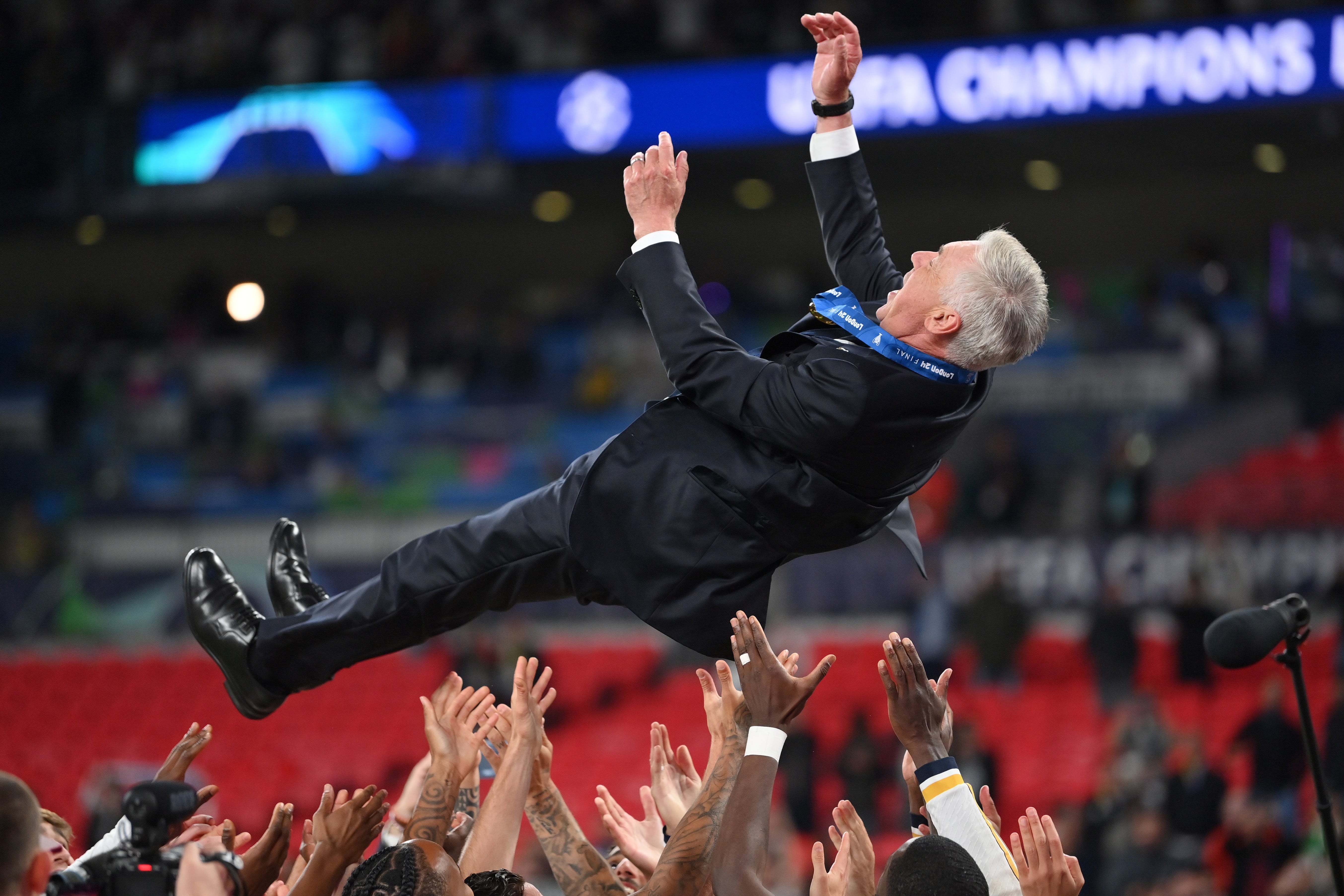 Real Madrid players throw Carlo Ancelotti in the air