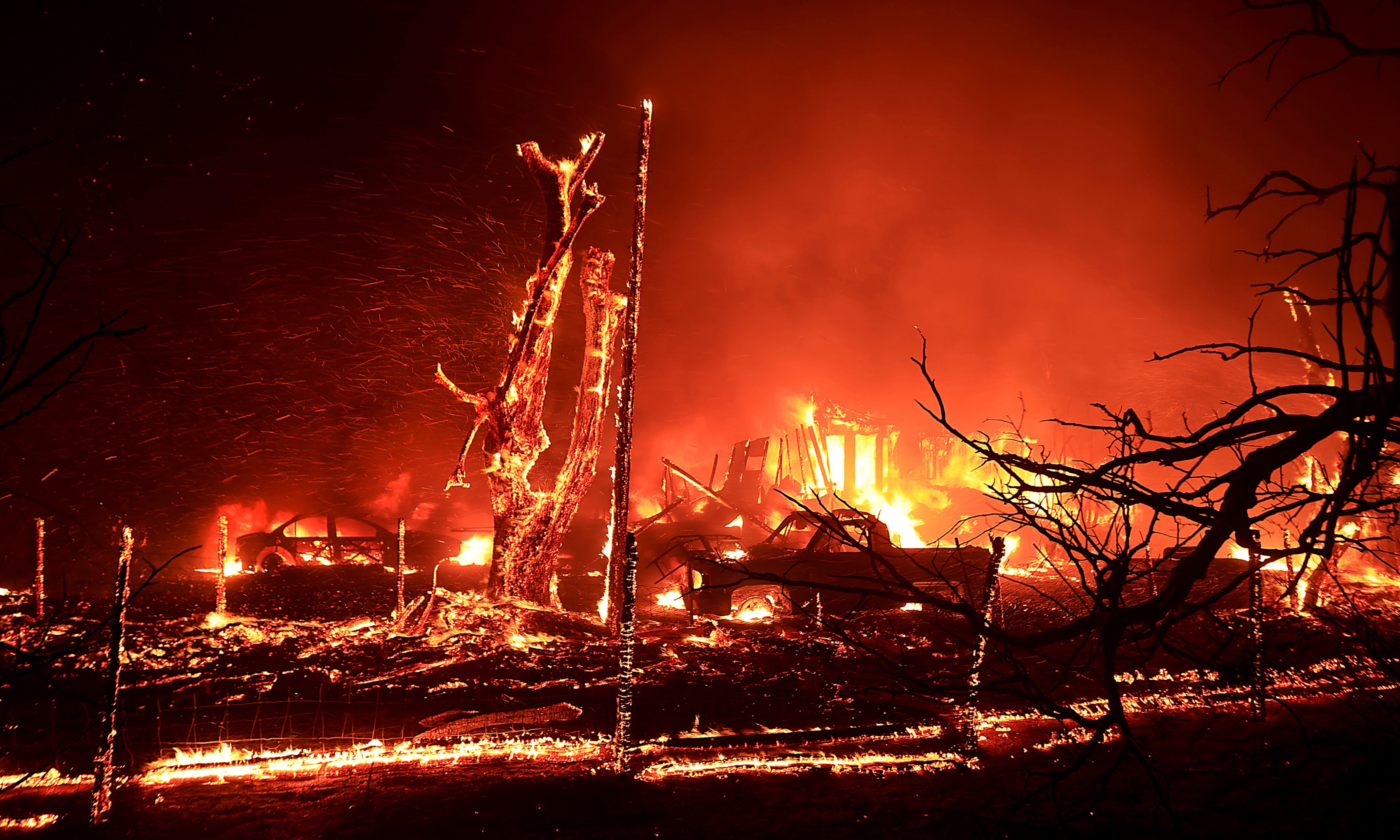 A home burns during the Corral Fire at Bernard and Stearman roads, west of Tracy, Calif., Saturday, June 1, 2024