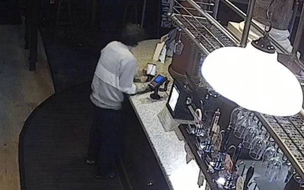 Jonathan Blundell caught on CCTV handling the collection boxes at the Wetherspoon pub in Nottingham