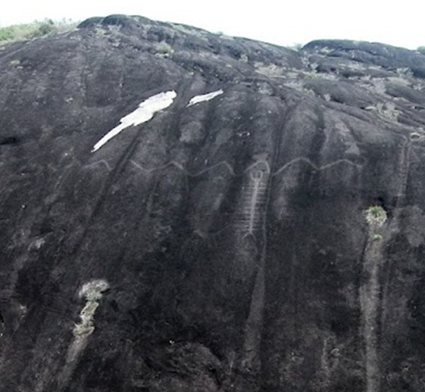 Prehistoric daring: More than a thousand years ago, three-quarters of the way up a 200 metre high cliff, Native American artists risked their lives to create this 43-metre-long engraving of a serpent. Immediately below the snake, they also engraved a giant centipede