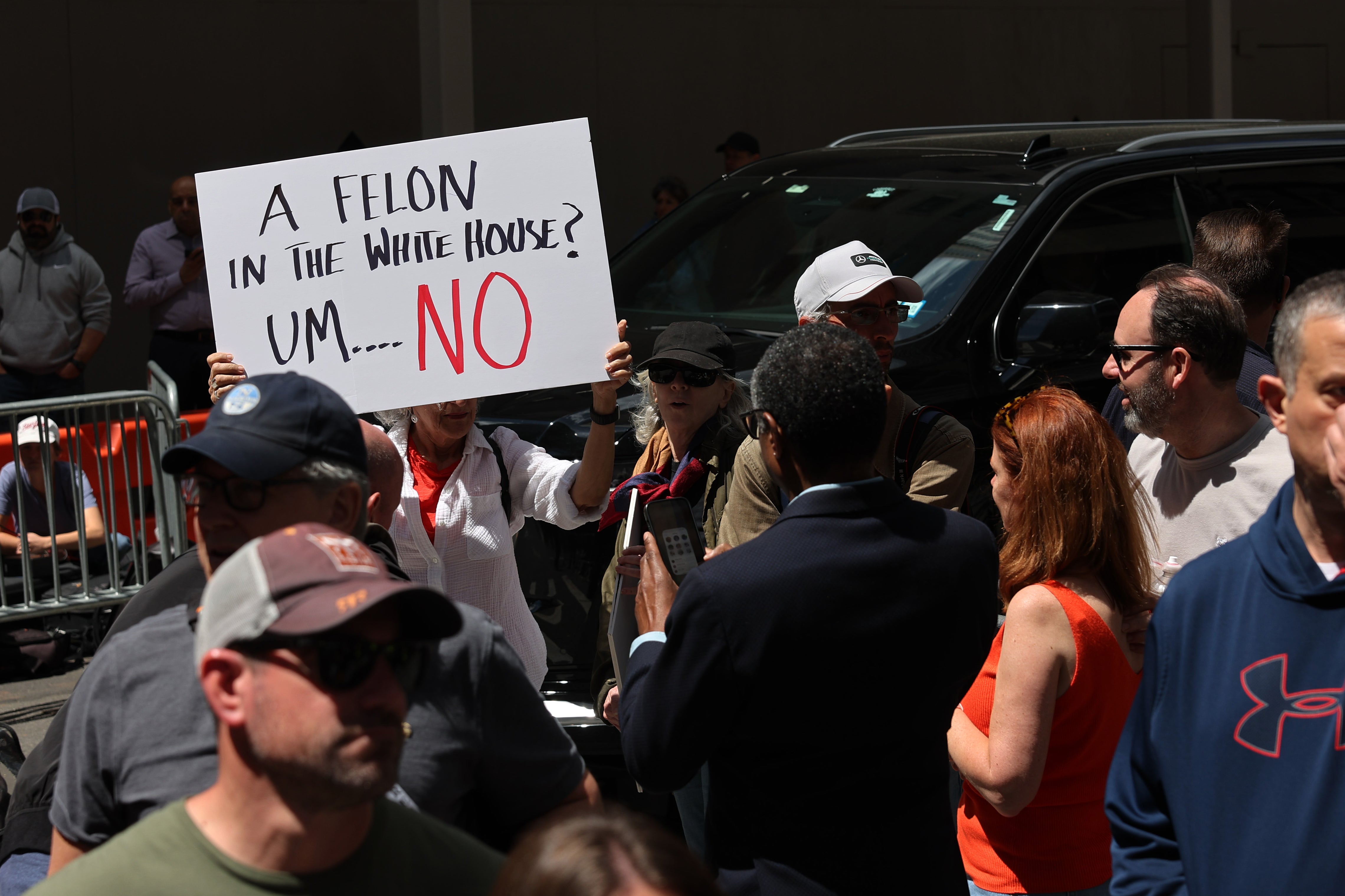 People gather as Donald Trump holds a press conference at Trump Tower on May 31, 2024 in New York City