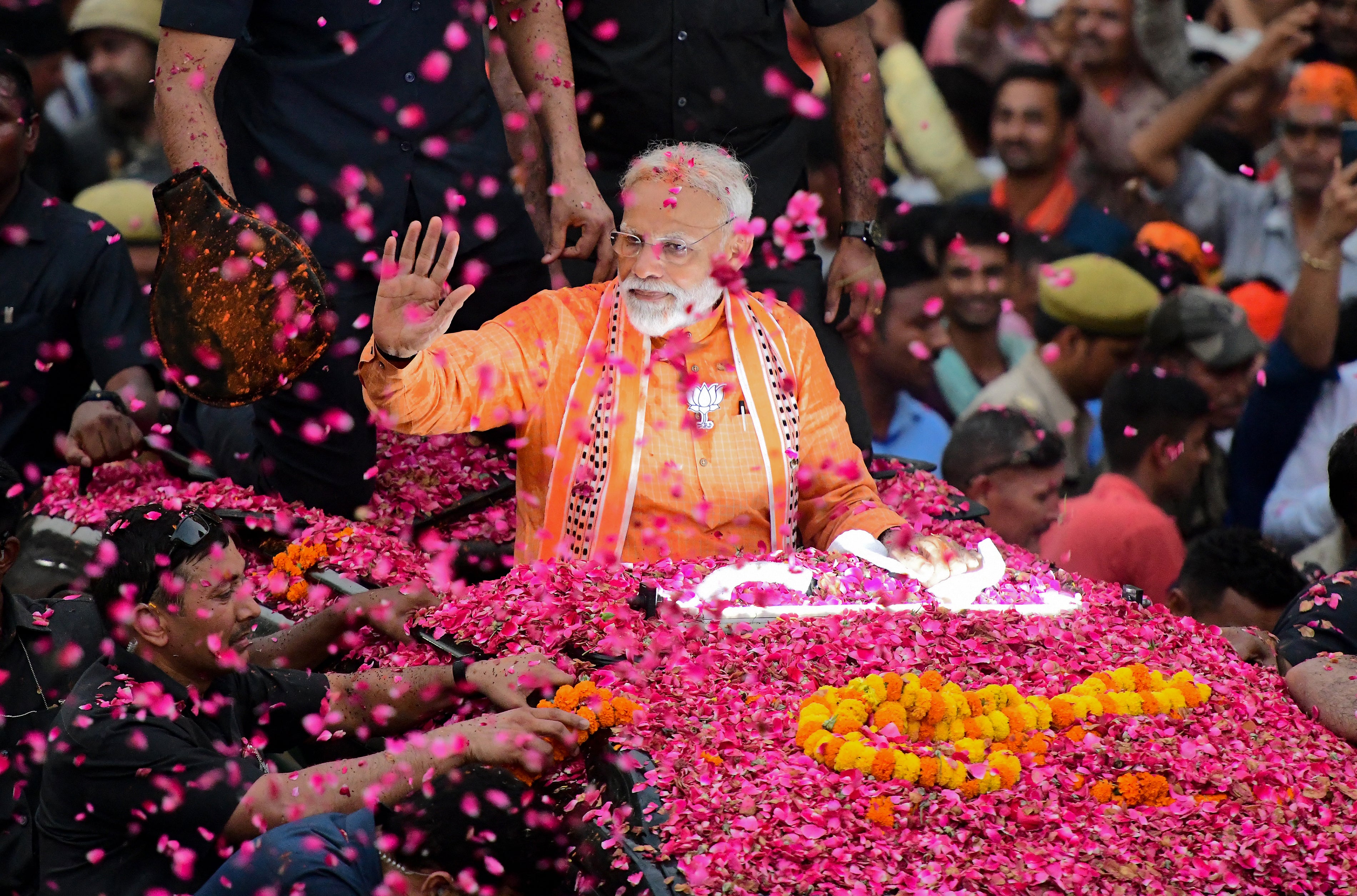 Modi gestures during a roadshow in Varanasi in 2019