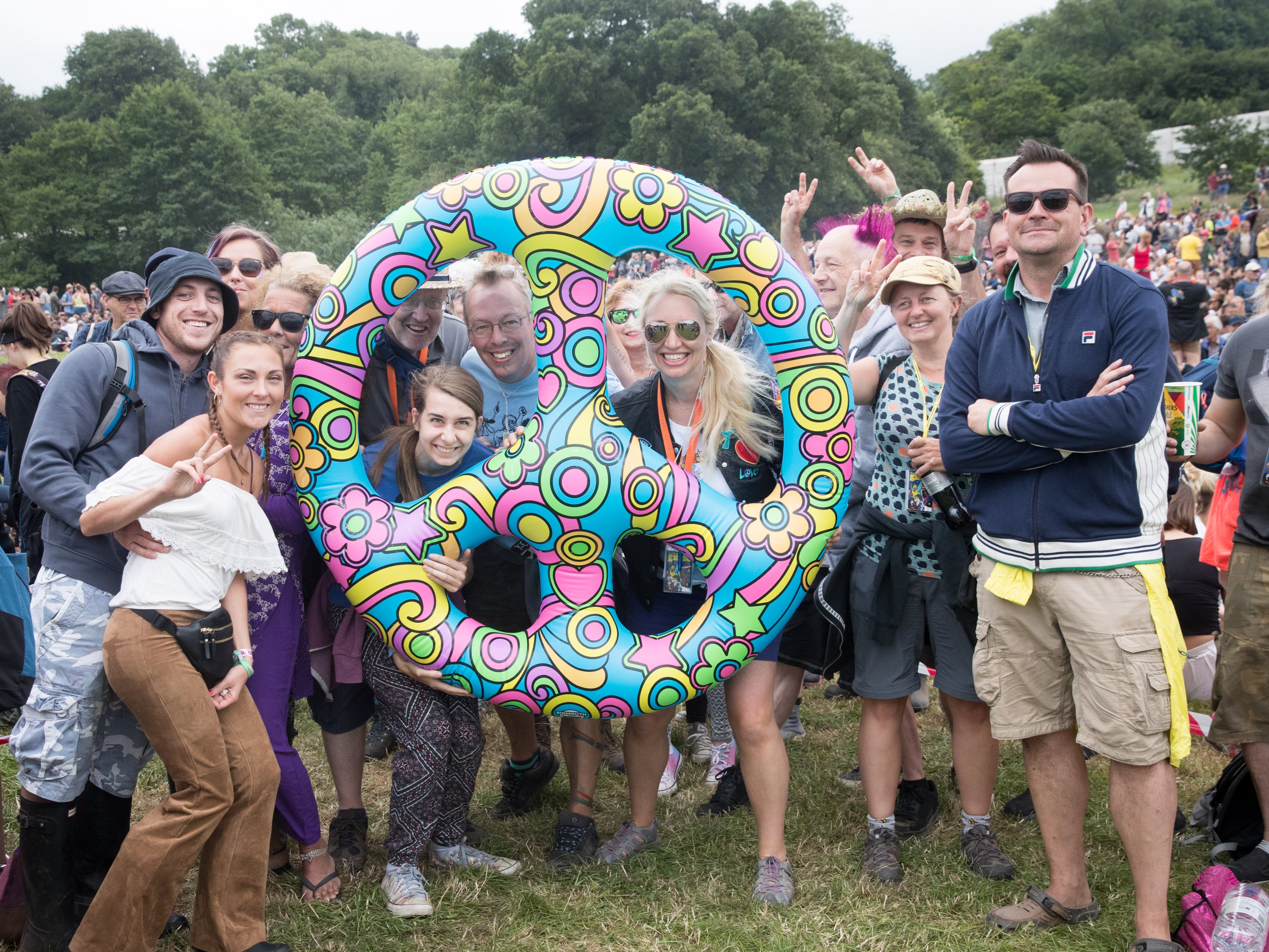 People gather at the Stone Circle at Glastonbury Festival